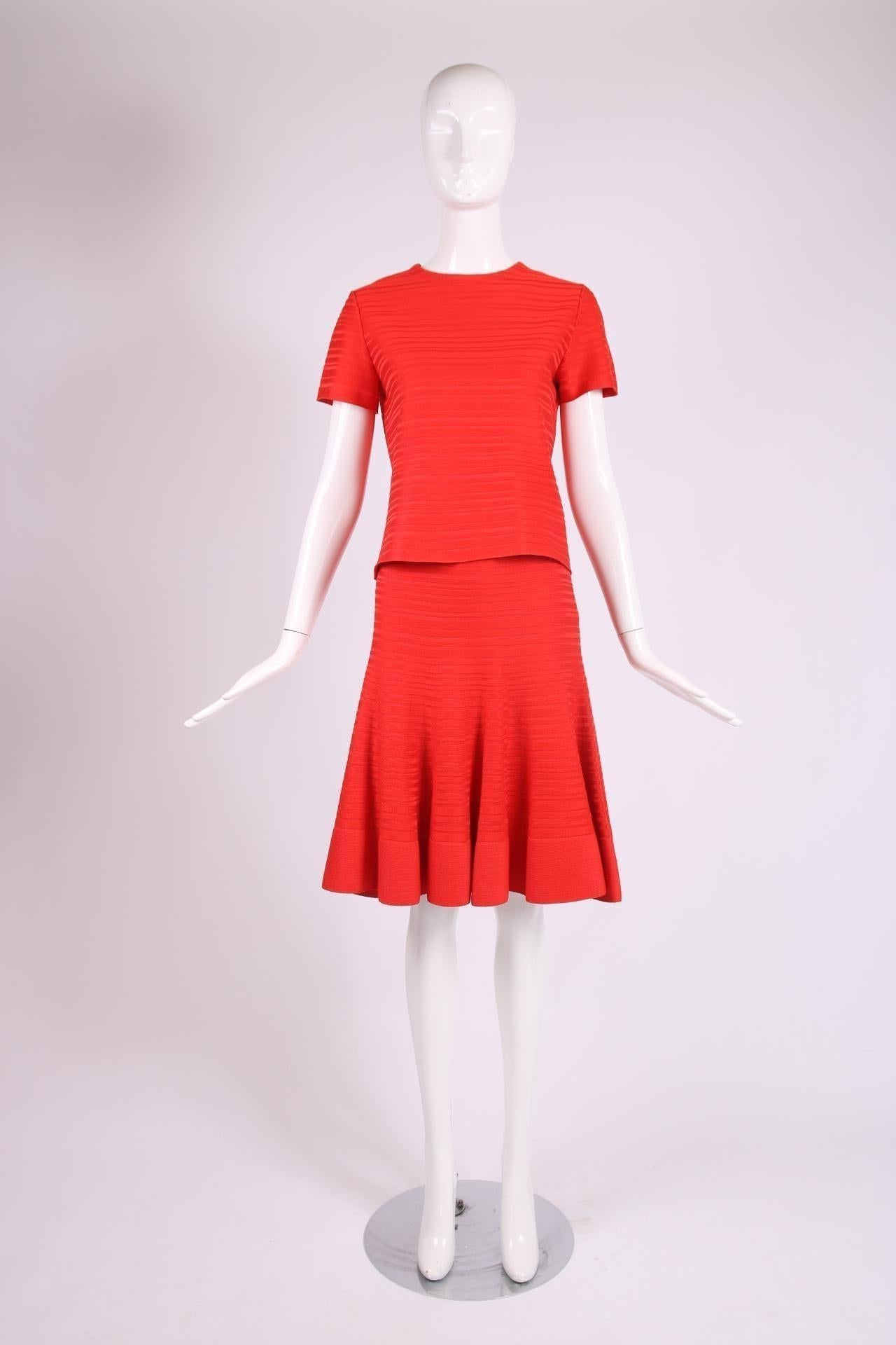 Christian Dior red ribbed, stretch crop top & flared skirt ensemble. Fabric is a silk blend - both are size tag 8. In excellent condition. Please consult measurements.

Top
Shoulders - 16