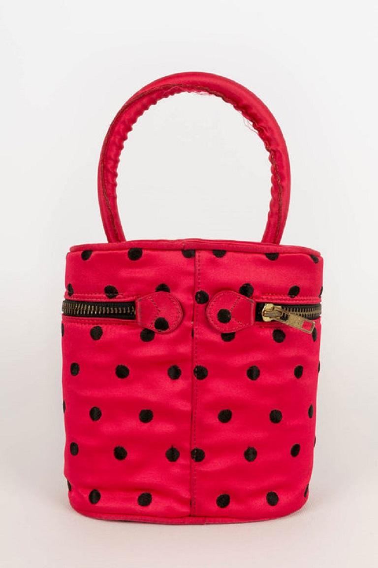 Dior -(Made in Italy) Red silk bag with black dots.

Additional information: 

Dimensions: 
Height: 16 cm, Length: 16 cm, Depth: 9.5 cm, Handle: 29 cm

Condition: 
Good condition
Seller Ref number: S94
