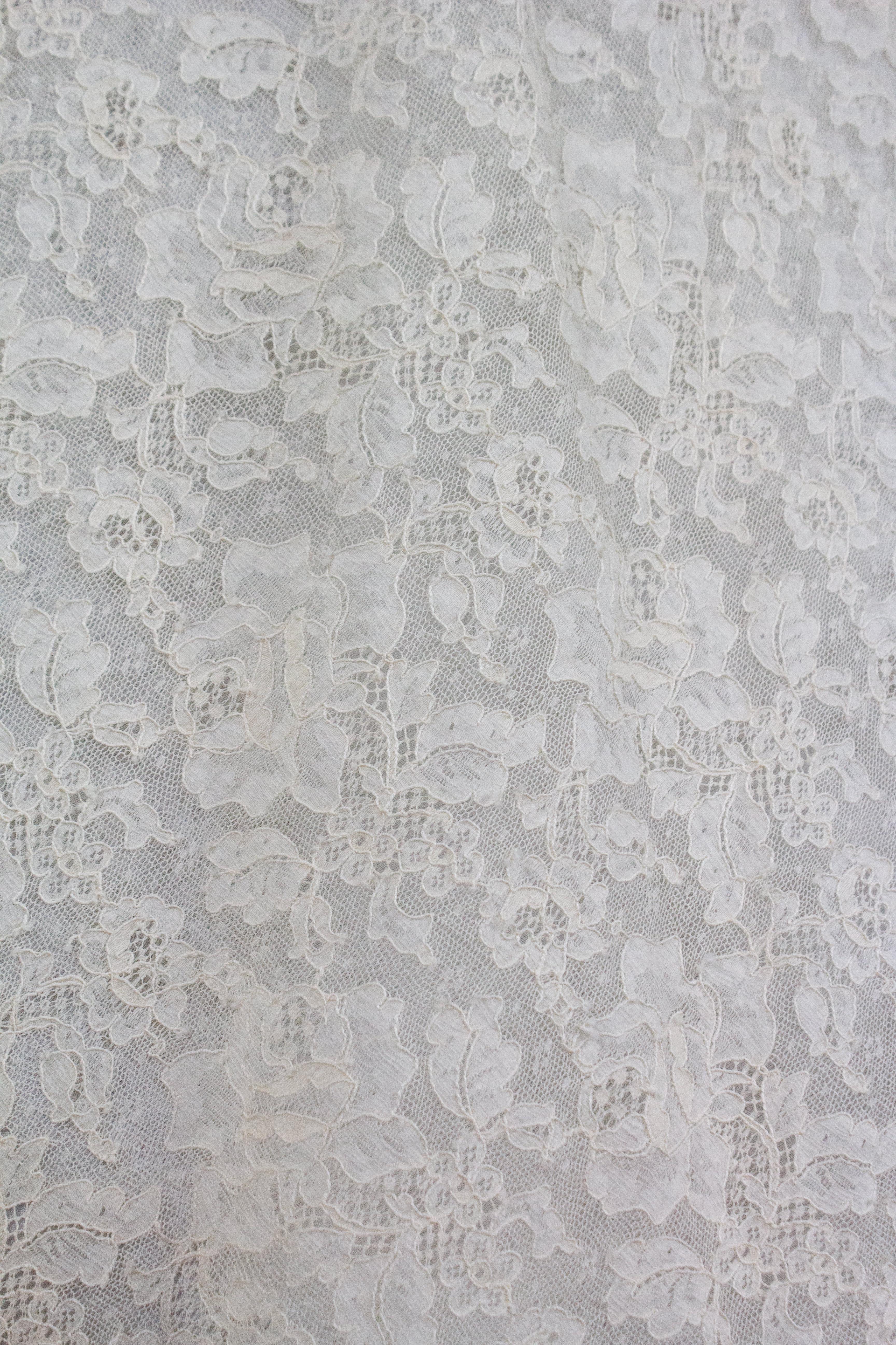 Christian Dior by John Galliano lace mini dress, from the Resort 1998 collection. Ivory coloured floral lace pattern, with dainty scalloped hem and silk lining.

Condition
Excellent

Marked Size
UK 14