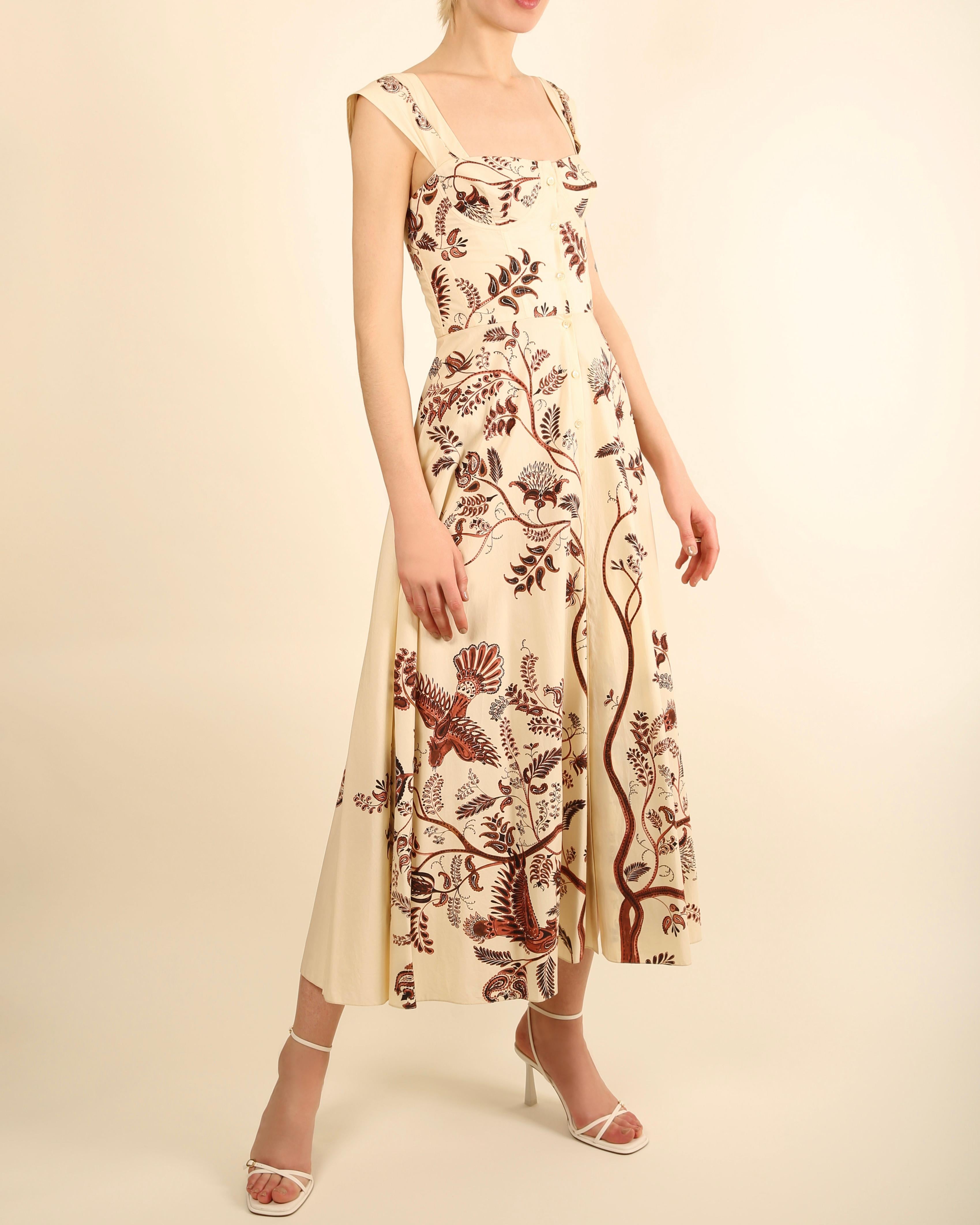 Christian Dior Resort 2018
Cream midi length dress with brown floral print
Boned corset upper with underwire cups
Button up front which is further secured by invisible hooks and a popper - these were possibly added on via the previous owner. Please