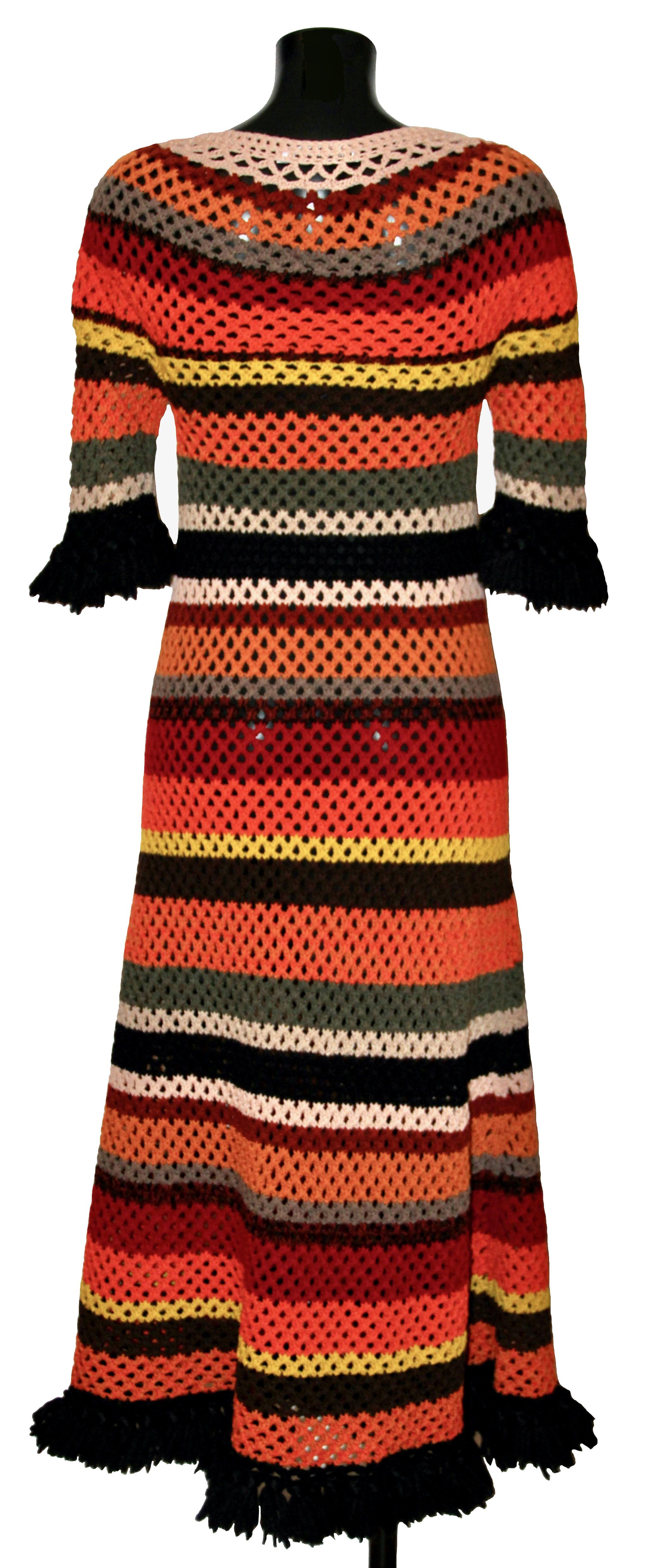 This 60's inspired dress from the 2018 Resort Collection from Dior is crocheted in kaleidoscopic stripes.
It features a ribbed neckline and a fringe finish at the hemline and sleeves.

Collection: Resort 2018
Fabric: 100% virgin wool
Color : Red,