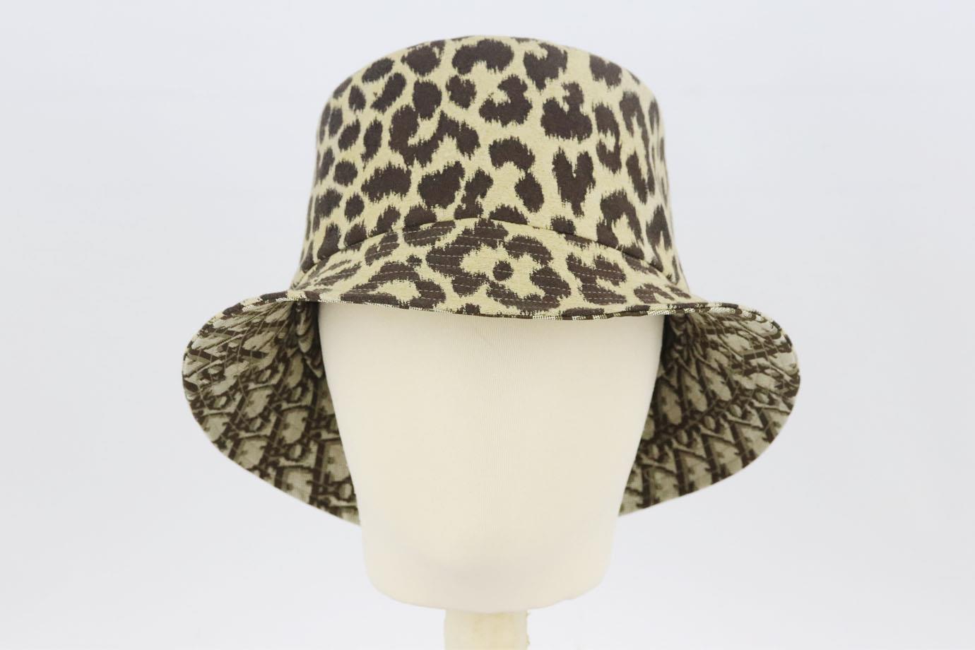 Christian Dior reversible leopard and oblique printed cotton bucket hat. Tonal-brown. Slips on. 46% Cotton, 46% polyester, 8% polyurethane; lining: 46% cotton, 46% polyester, 8% polyurethane. Does not come with dustbag or box. Size: Medium (57 cm).