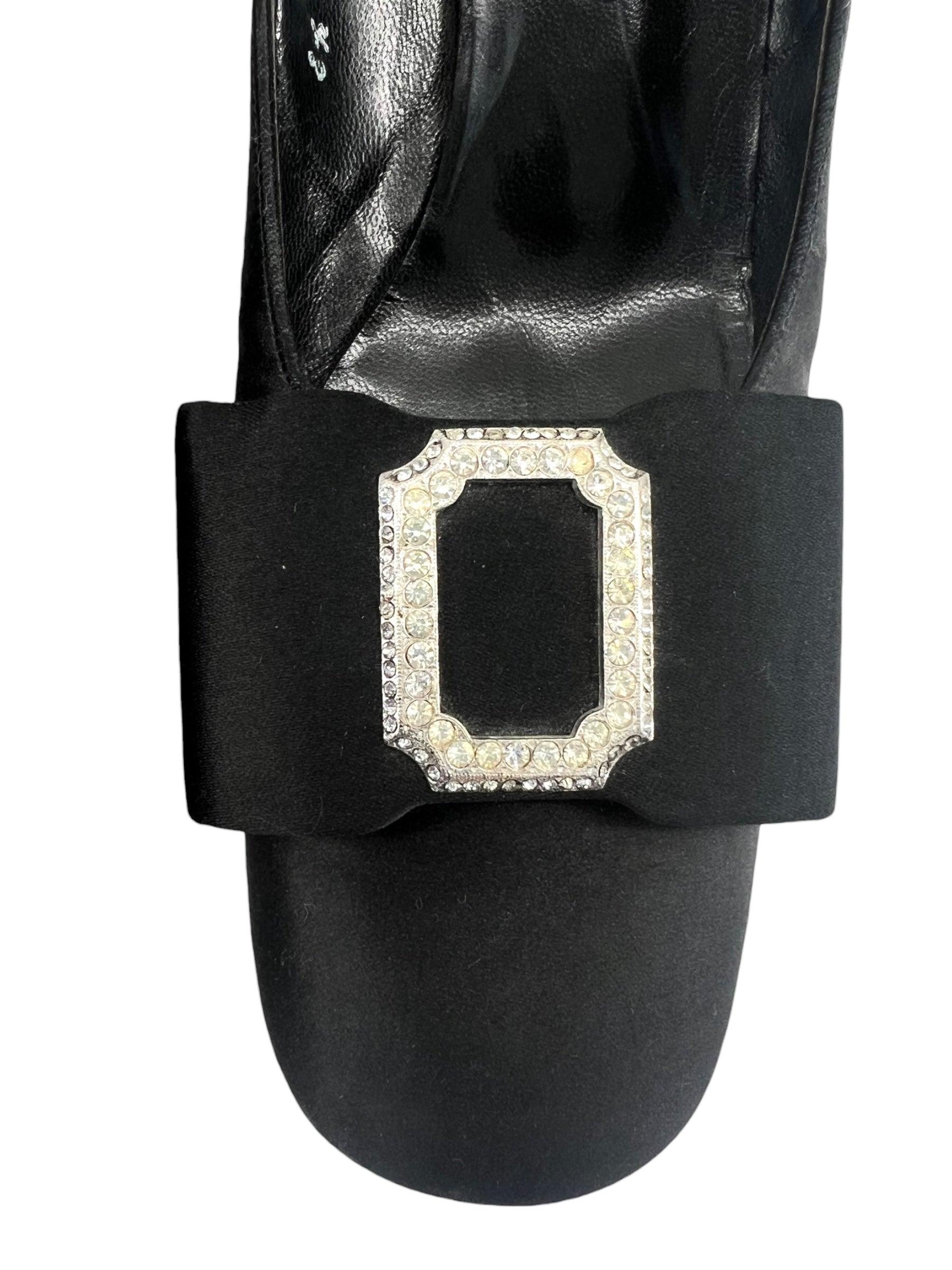 Classic 1960's satin bow front pumps by Christian Dior Souliers. Elegant black satin with a decorative rhinestone buckle with silver toned backing. Pair these beauties with your favorite little black dress and a pair of evening gloves for an Audrey