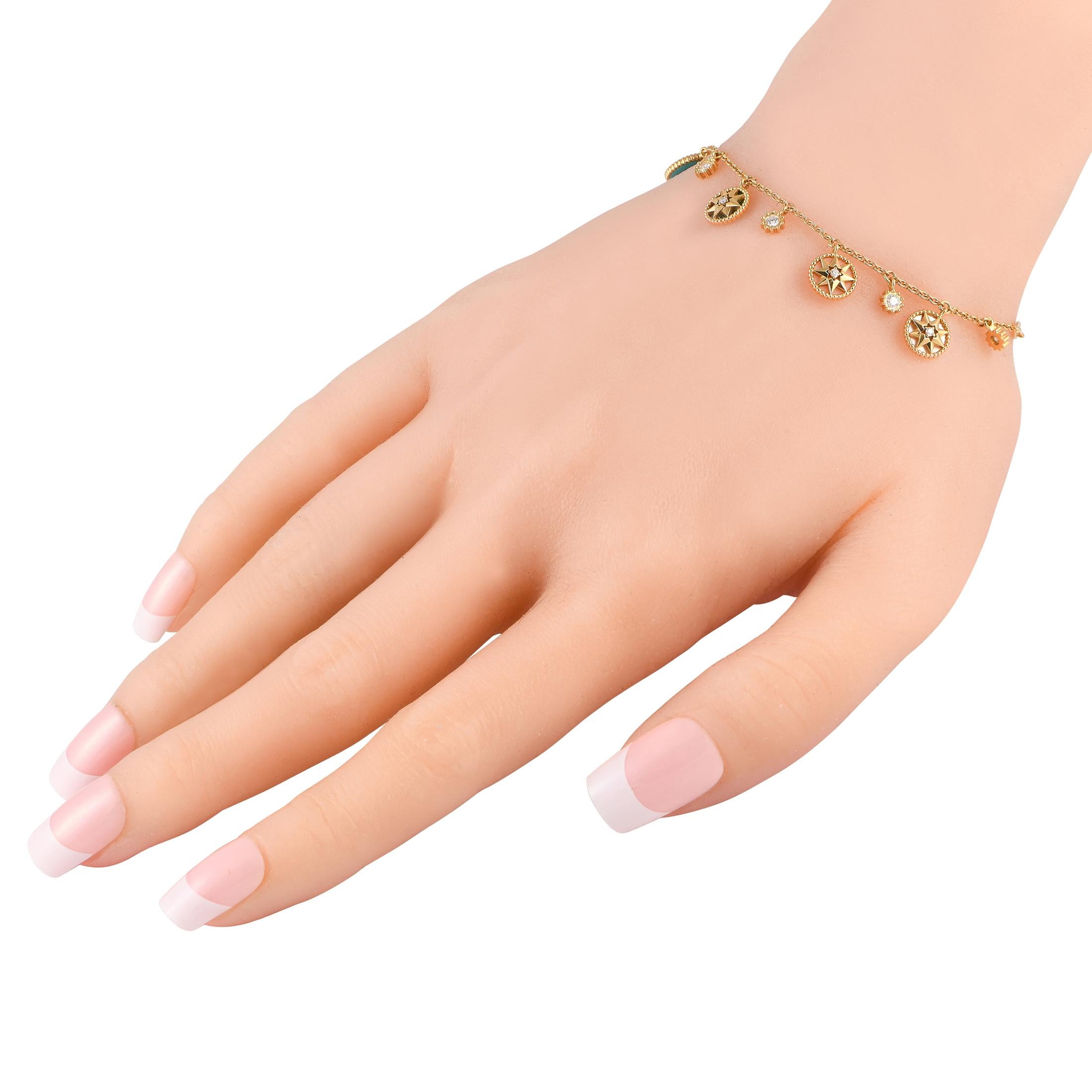 A series of emblematic charms hand delicately from a 6.75 long chain on this delicate Dior Rose des Vents bracelet. Elevated by colorful ornamental stones and shimmering Diamond accents, this exquisite accessory comes complete with secure lobster