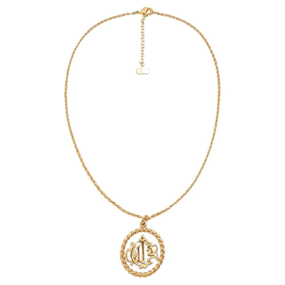 CHRISTIAN DIOR Round Logo Cutout Pendant Necklace in Gold