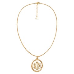 CHRISTIAN DIOR Round Logo Cutout Pendant Necklace in Gold