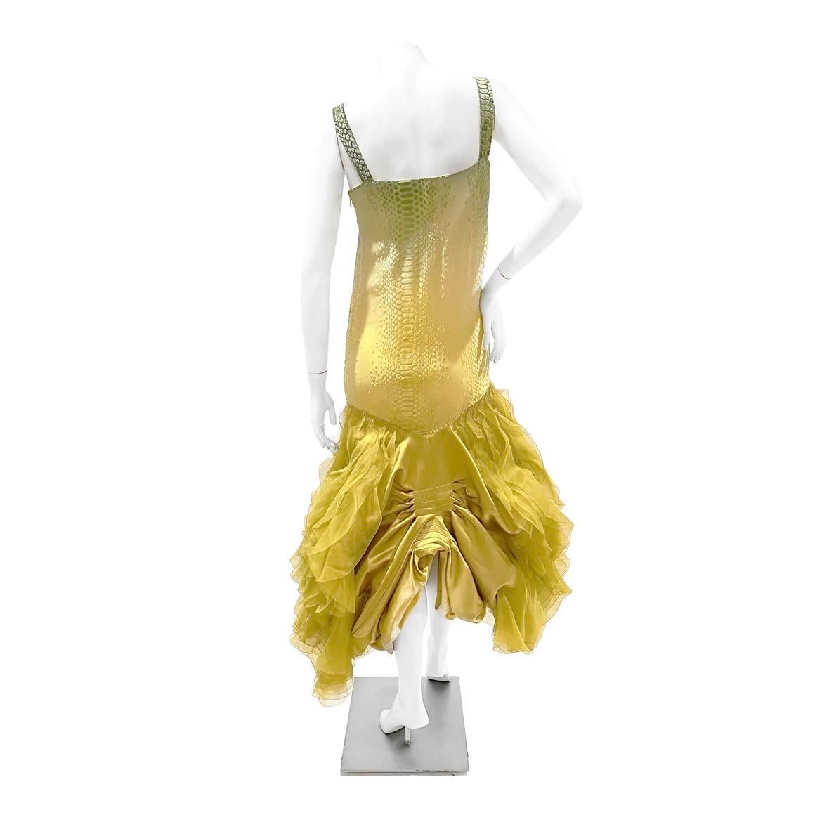 Ruched Yellow Ruffle Reptile Print Gown by John Galliano for Christian Dior
Fall / Winter 2004 Ready-To-Wear
Look 2
Yellow with green gradient detail on top
Reptile print detail on top of gown
Sheer yellow ruffle embellishment on sides of