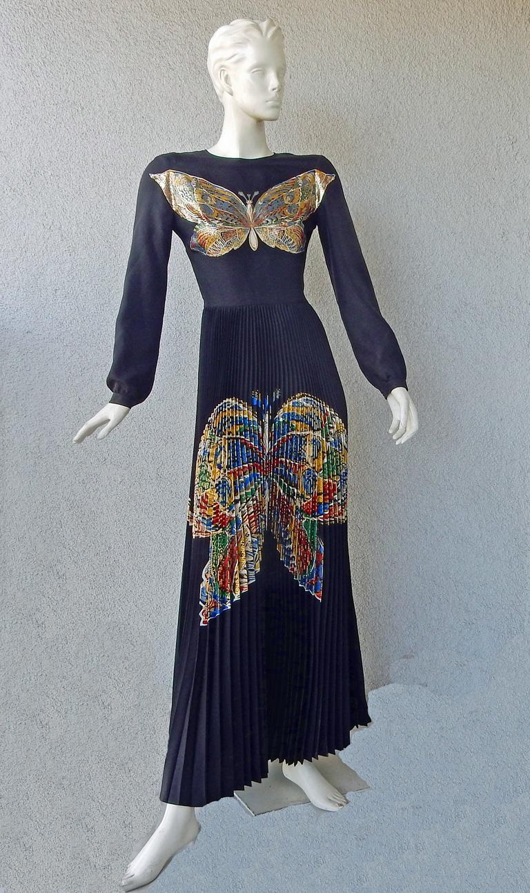 Christian Dior graphic butterfly silk dress as seen on the runway.  Maria Grazia Chiuri    referenced early Christian Dior’s archives which inspired her to create this graphic butterfly image featuring gold lame with a palette of rich jewel tones. 
