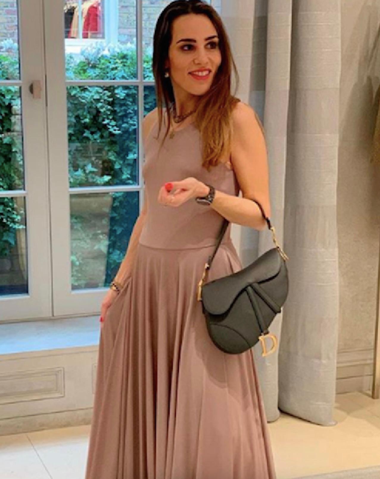 This mauve nude jersey dress is from the Christian Dior Spring/Summer 2019 collection, a season dedicated to the grace and strength of ballet dancers. The dress features a minimalist tank-style bodice with a scoop neckline and narrow straps, flowing