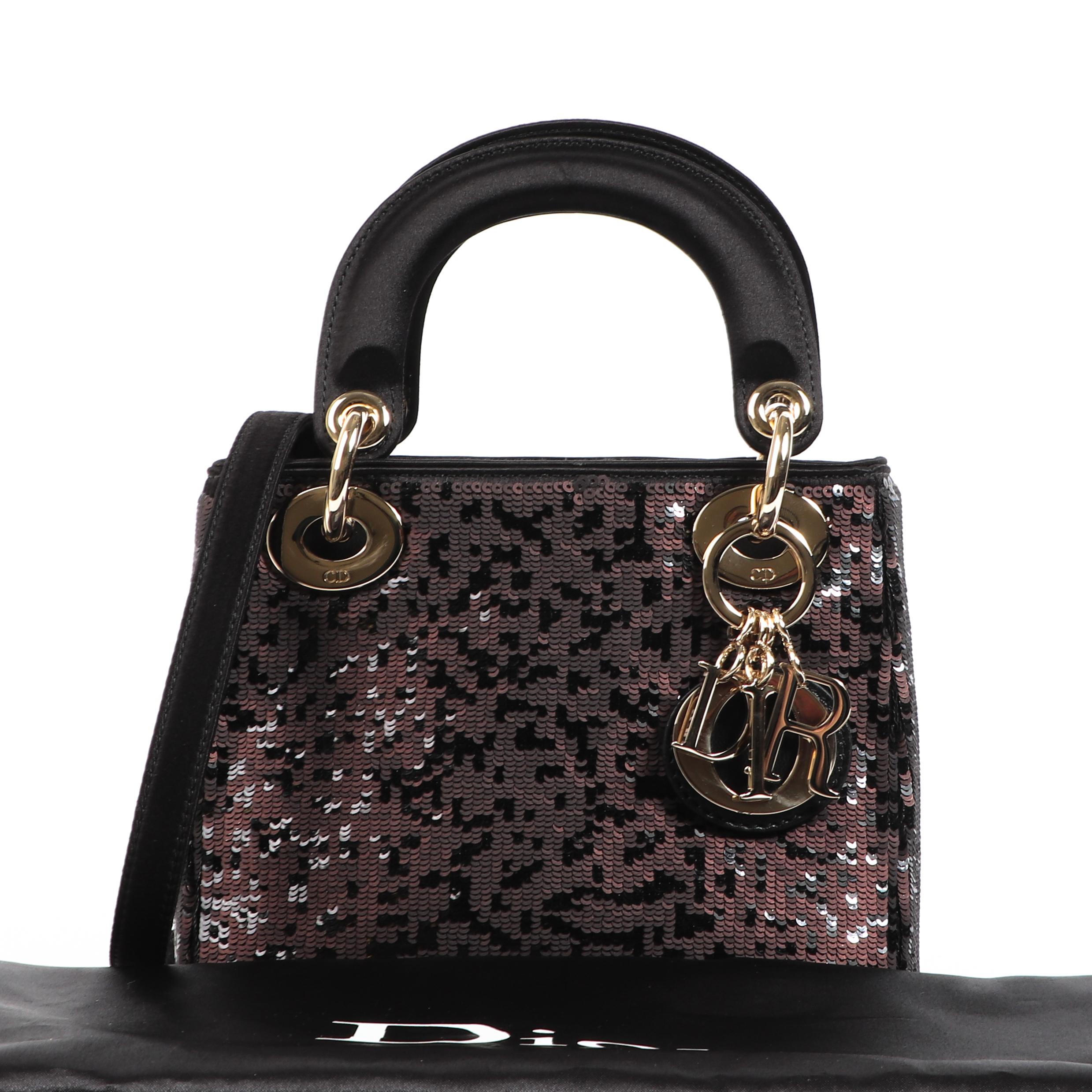 Christian Dior Sequin Embellished Satin ABC Mini Lady Dior

Wauw, this limited edition Lady Dior is such a piece of art! Crafted from a black toned satin, embellished by black and brown-toned sequins. The inside consists of small compartment,