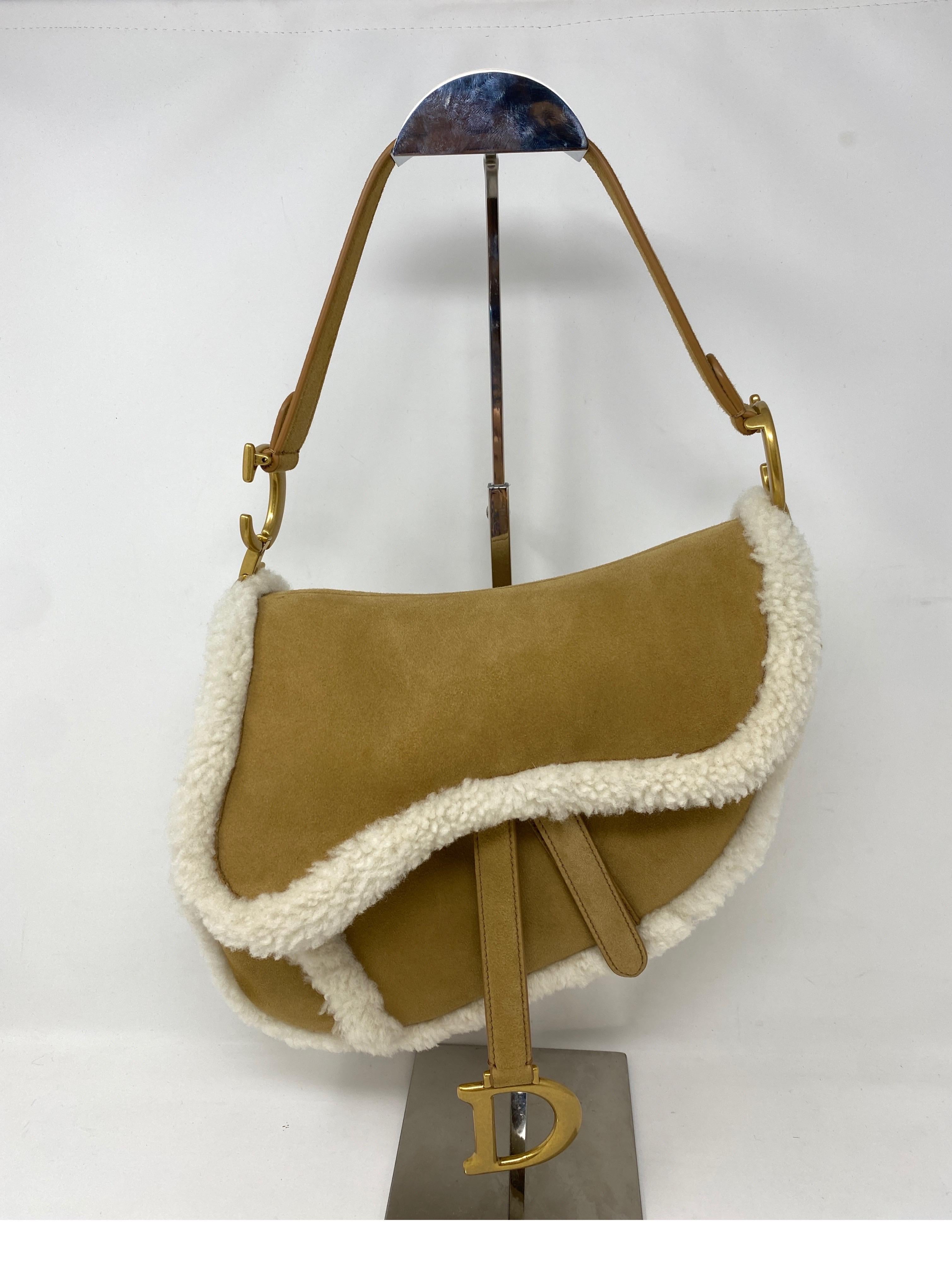 Christian Dior Sheepskin Saddle Bag. Mint condition like new. Beautiful sheepskin and tan suede saddle bag. Iconic design and most wanted style of the moment. Includes dust cover and box. Guaranteed authentic. 