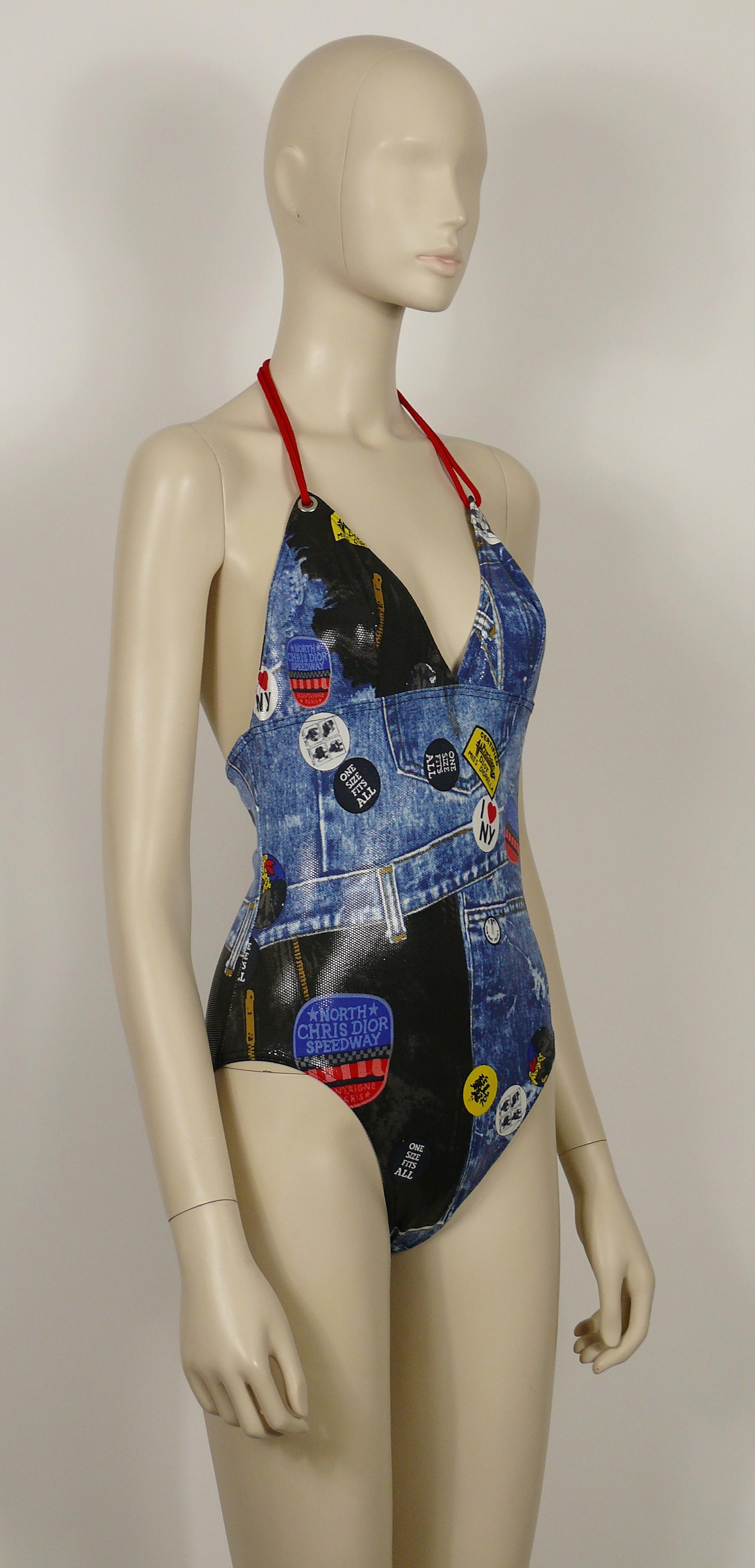 CHRISTIAN DIOR vintage shiny wet look MISS DIORELLA one-piece swimsuit featuring a denim trompe l'oeil print and patches.

Adjustable ties at neck red ropes.

Label reads CHRISTIAN DIOR.
Made in France.

Size tag reads : FR 44 / EUR 42 / INT