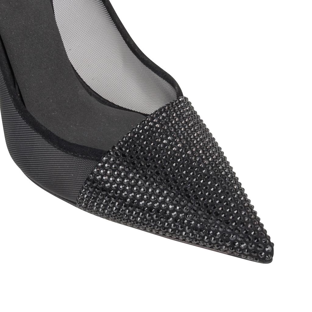 Guaranteed authentic Christian Dior black pump with beautiful details. 
Black small diamante beads are angled at the toe. 
Heel of foot and shaped heel are covered in the black diamantes.
Sides of the foot are black mesh.
Inner sole is lined with