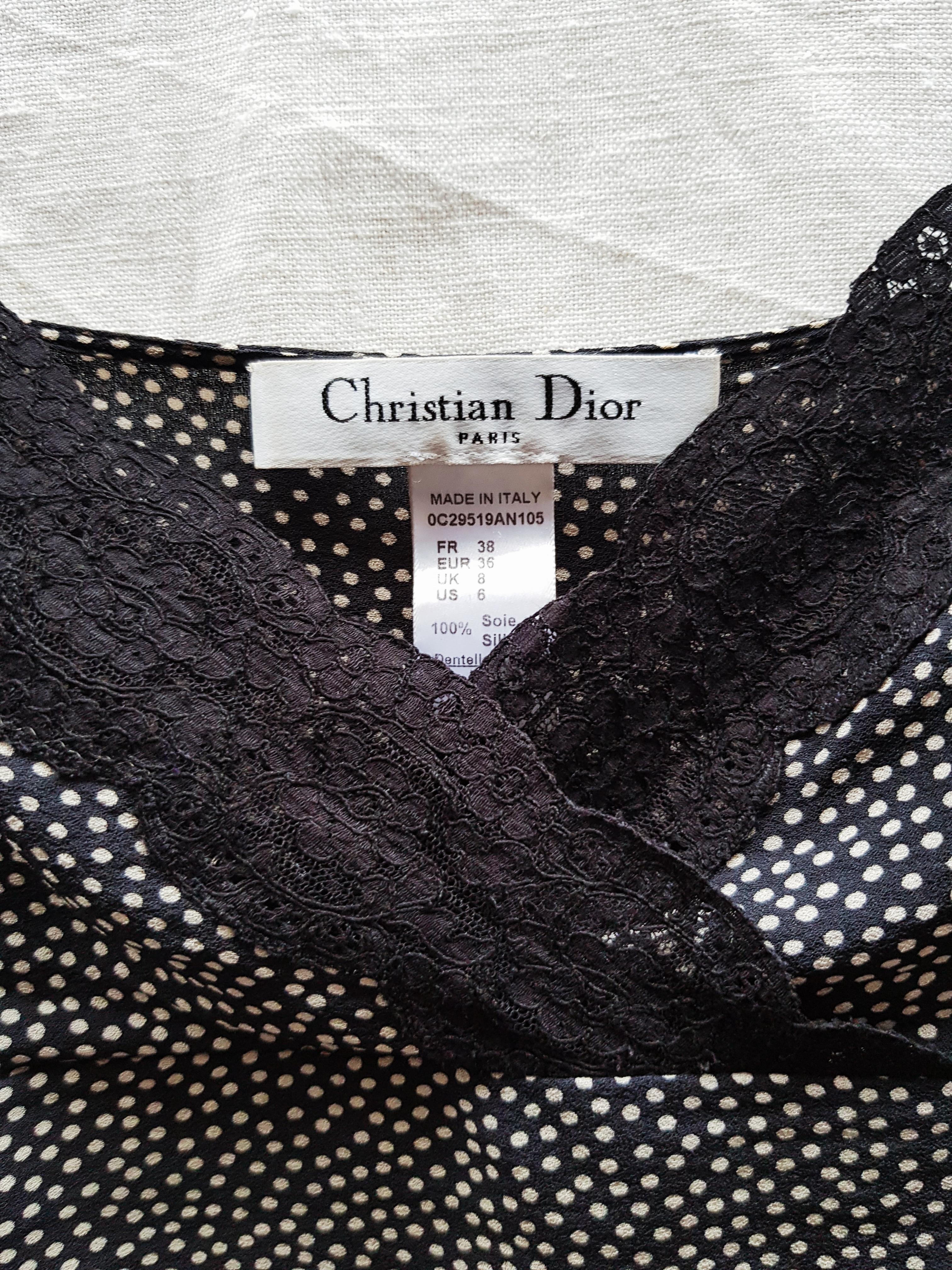 Christian Dior cami top, John Galliano area

- Closed by twelve fabric buttons
- Black lace embellished neckline
- Made in Italy
- Circa 1999-2009
- 100% Silk
- Estimated size: 36 FR to 38 FR (marked as 38 FR)
- Very good conditions