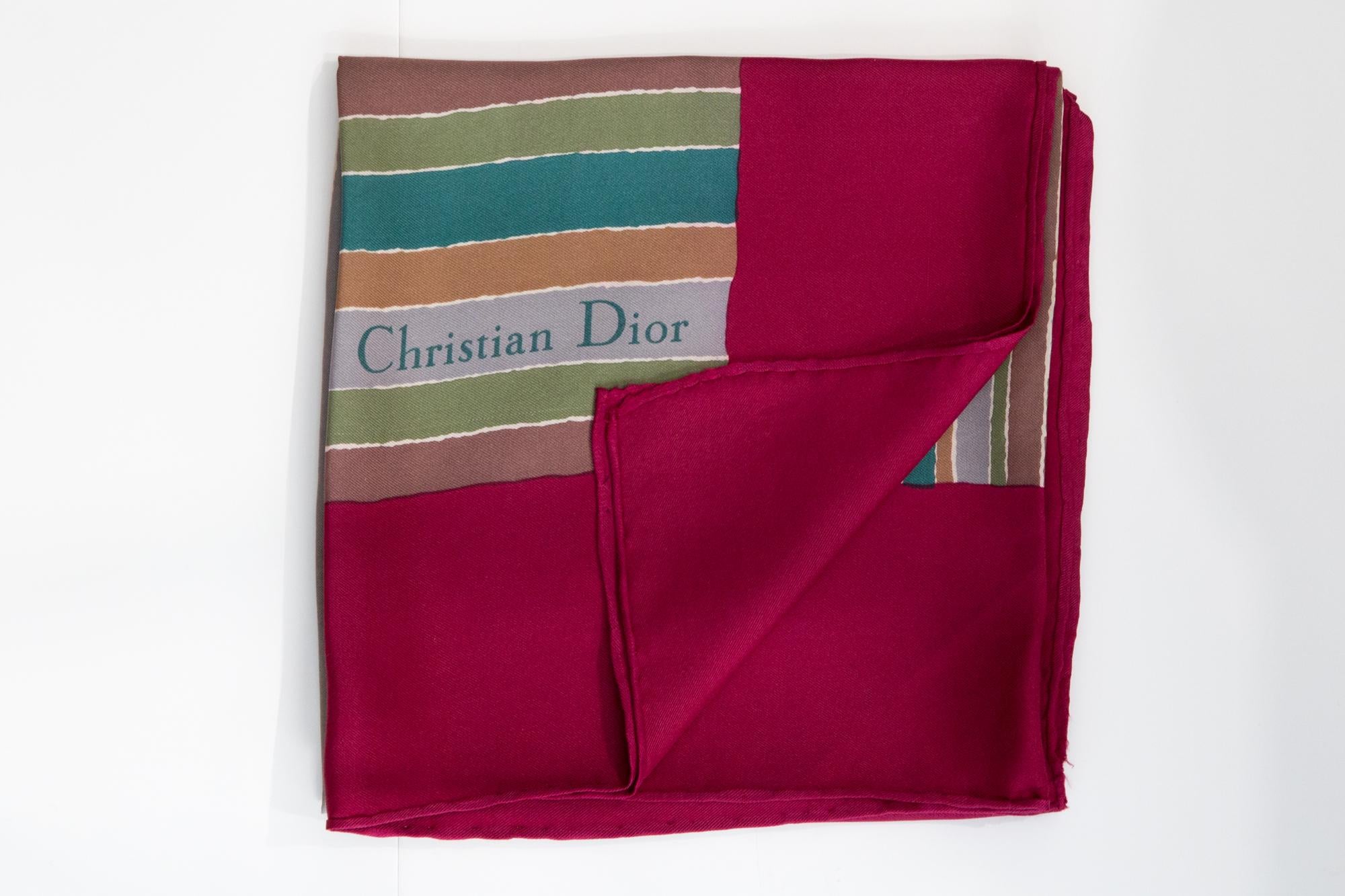 Christian Dior Silk Scarf featuring a red border, a Christian Dior signature. 
Circa 1980s
In good vintage condition. Made in France.
30.7in (78cm)  X 30.7in (78cm)
We guarantee you will receive this  iconic item as described and showed on