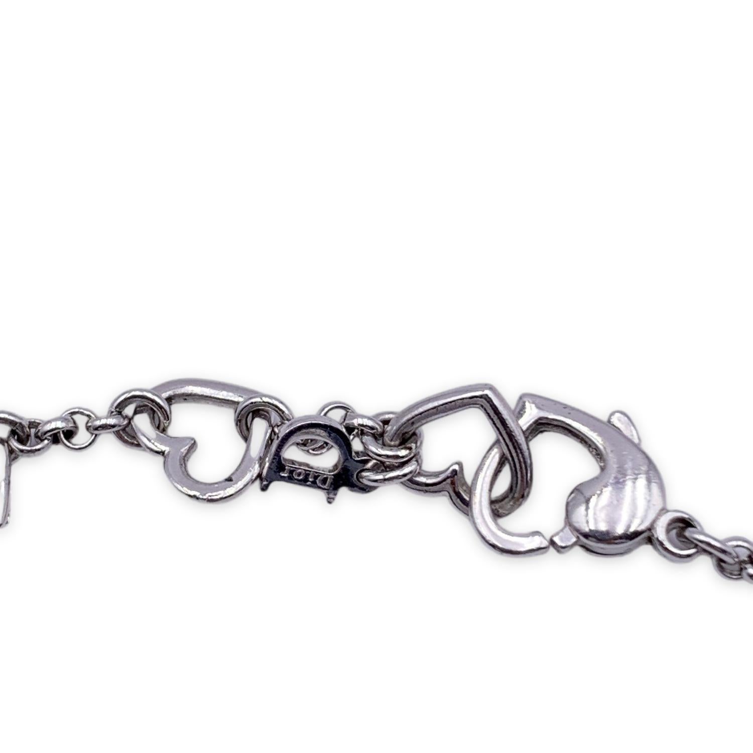 Silver metal bracelet by CHRISTIAN DIOR. Dior spelled out with hearts in between each letter with small crystals in the letters. Adjustable. Lobster closure. Total lenght: 7.5 inches - 19 cm



Condition

A - EXCELLENT

Gently used. Please check