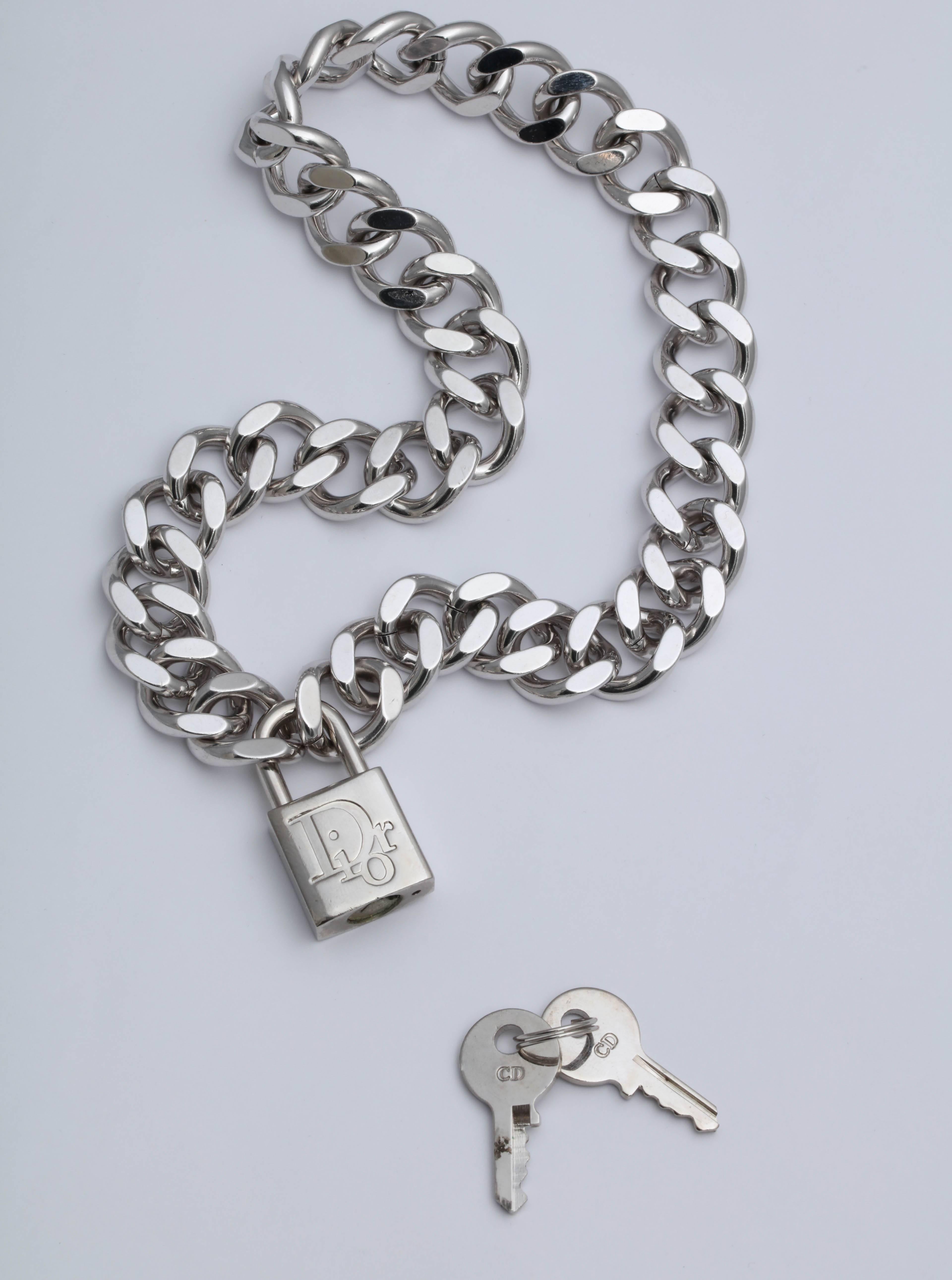 Christian Dior padlock necklace with logos. Comes with keys. The color is silver. From Galliano era. 