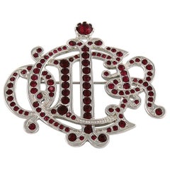 Christian Dior Silver Toned Faux Ruby Insignia Brooch
