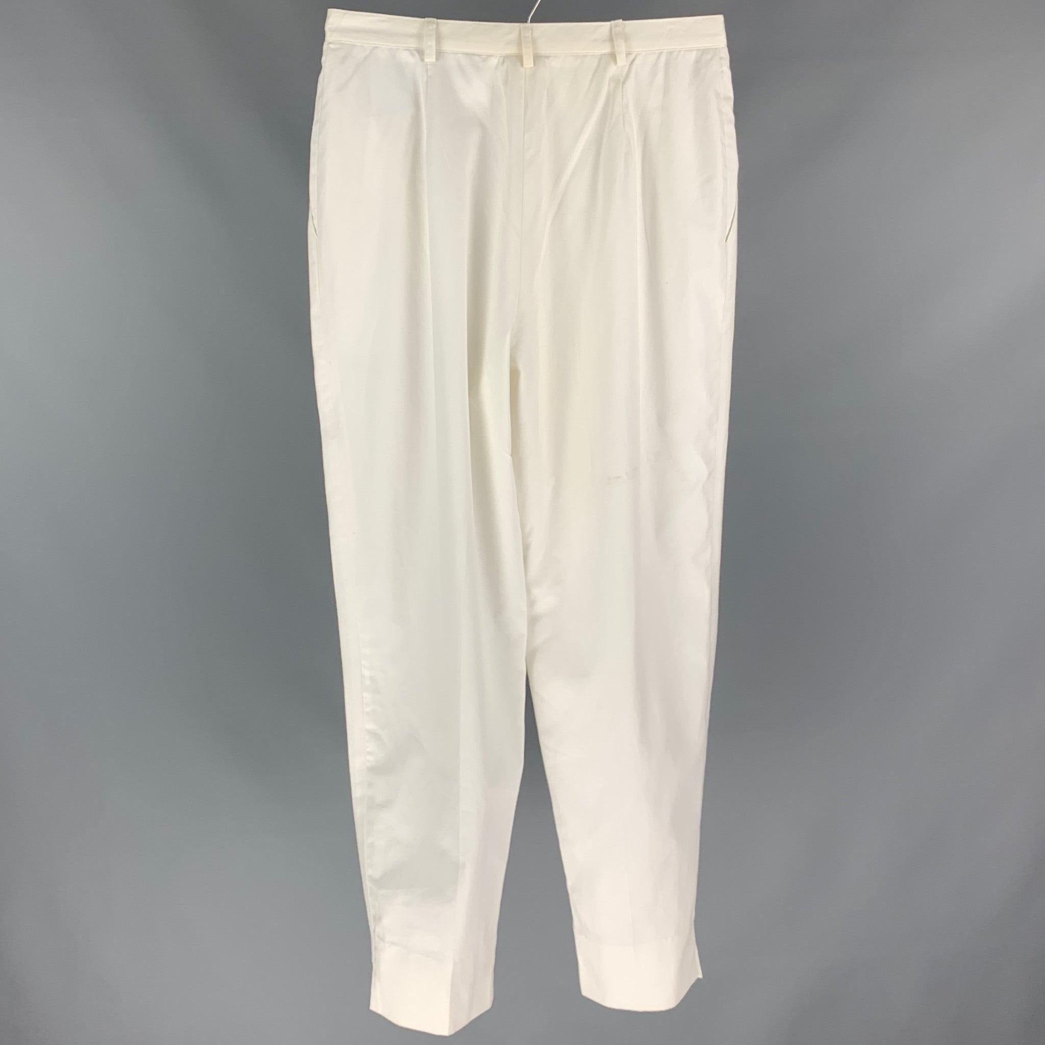 CHRISTIAN DIOR dress pants comes in a white material featuring a high waisted style,wide leg, pleated, and a zip fly closure. Made in USA.Good
Pre-Owned Condition. 

Marked:   14 

Measurements: 
  Waist: 31 inches  Rise: 14.5 inches  Inseam: 29