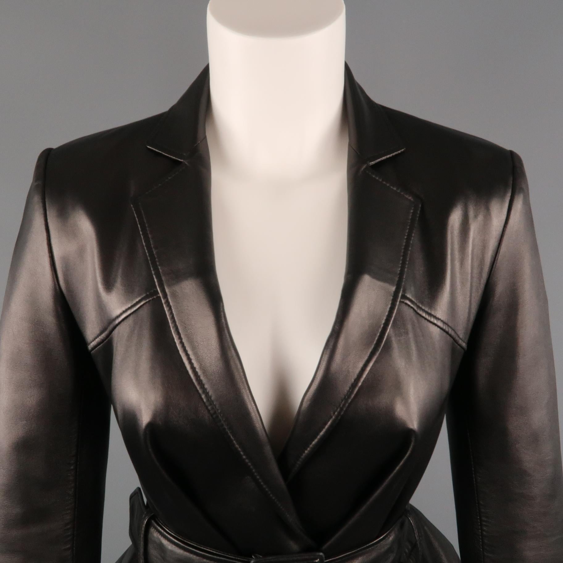 Archive CHRISTIAN DIOR BOUTIQUE by JOHN GALLIANO blazer comes in smooth black leather with a notch lapel, deep v neckline, mock flap pocket sides, and oversized cut that works into a peplum when belted. Made in Italy.
 
Excellent Pre-Owned