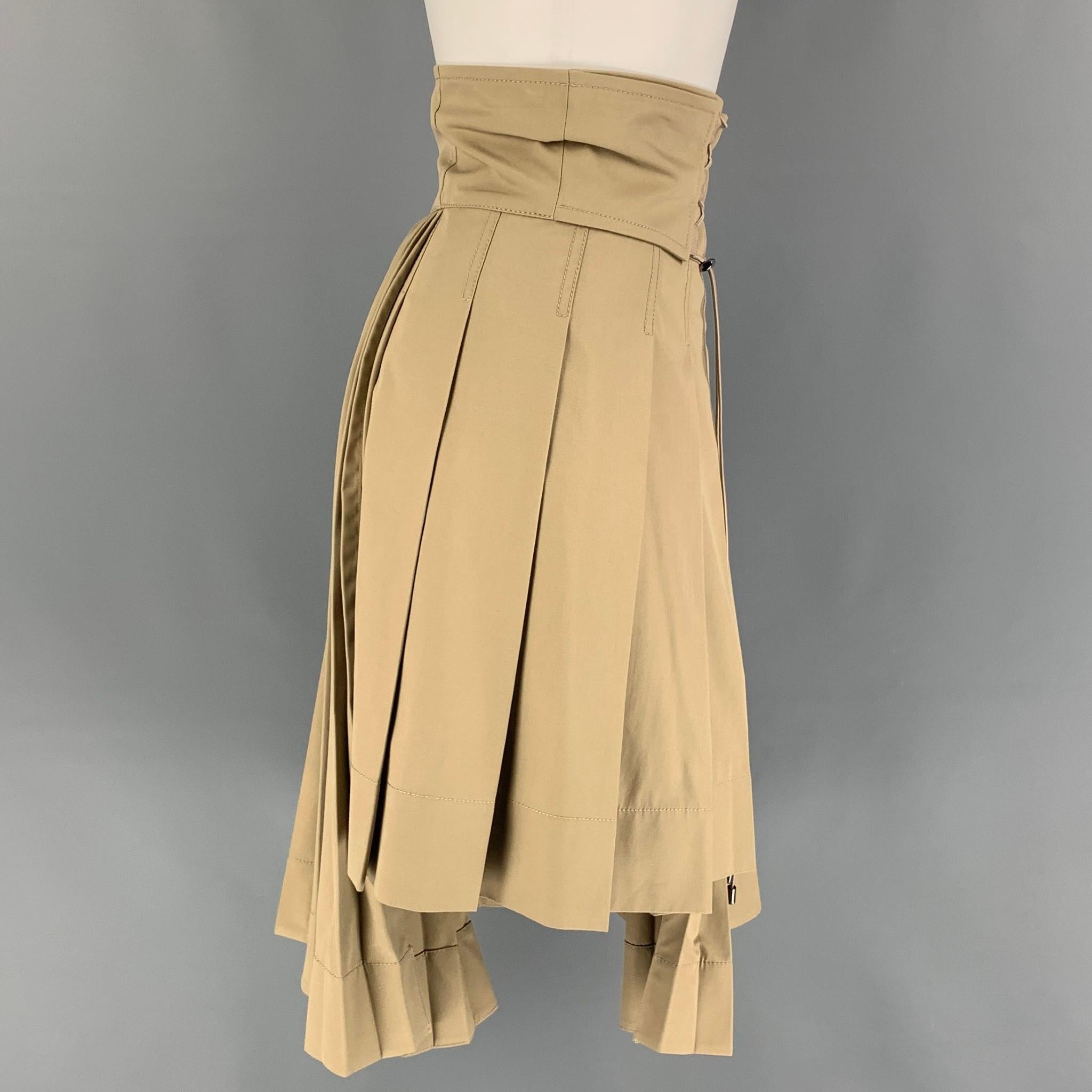 CHRISTIAN DIOR skirt comes in a khaki cotton gabardine featuring an asymmetrical style, high drawstring waist, wide waistband, and a side zipper closure. Made in Italy.

New With Tags. 
Marked: 4
Original Retail Price: