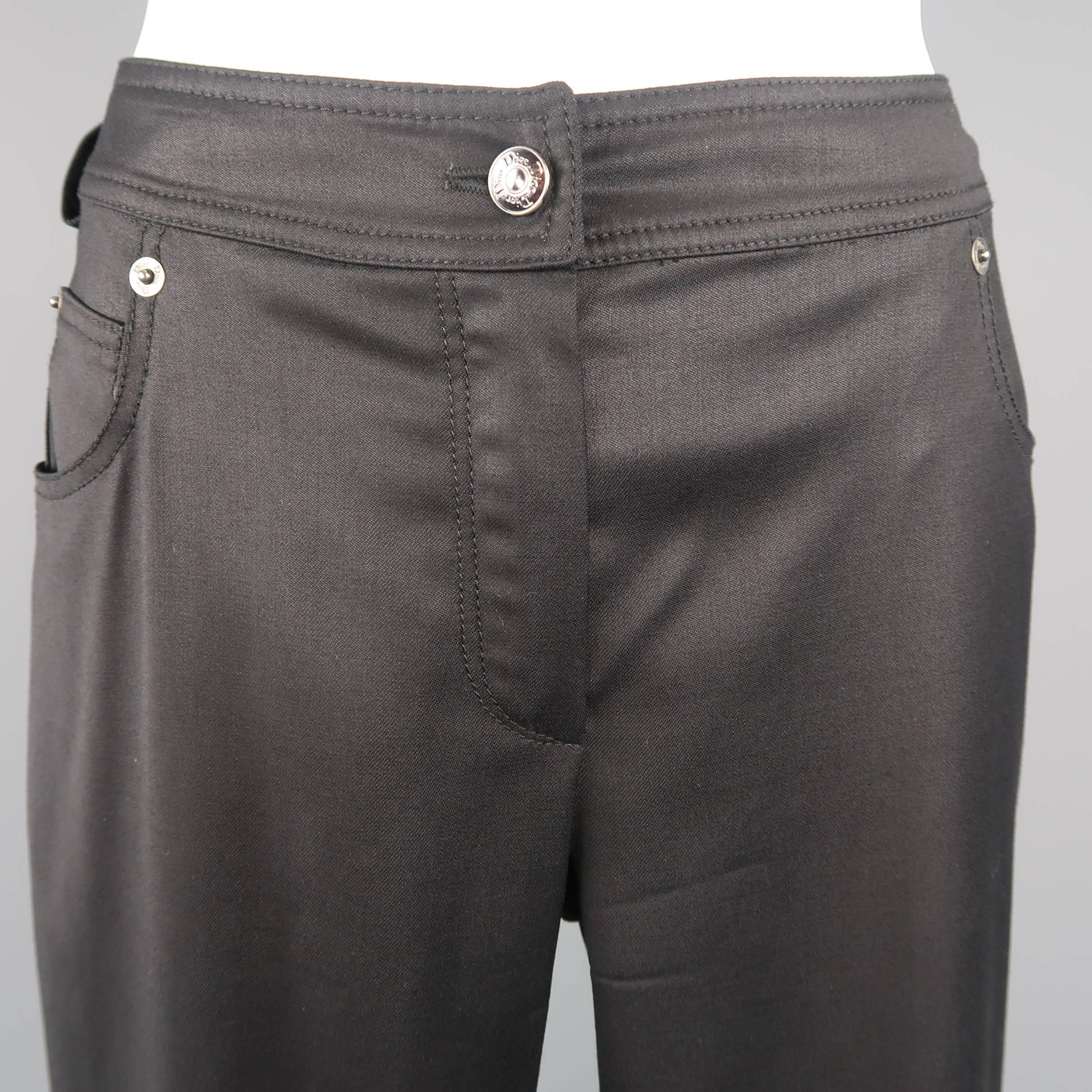 Archive CHRISTIAN DIOR by JOHN GALLIANO pants come in a stretch wool coated twill and feature grommet trim, stretch silk liner, and silver tone buckle accented pockets. Made in France.
 
Good Pre-Owned Condition.
Marked: 6
 
Measurements:
 
Waist: