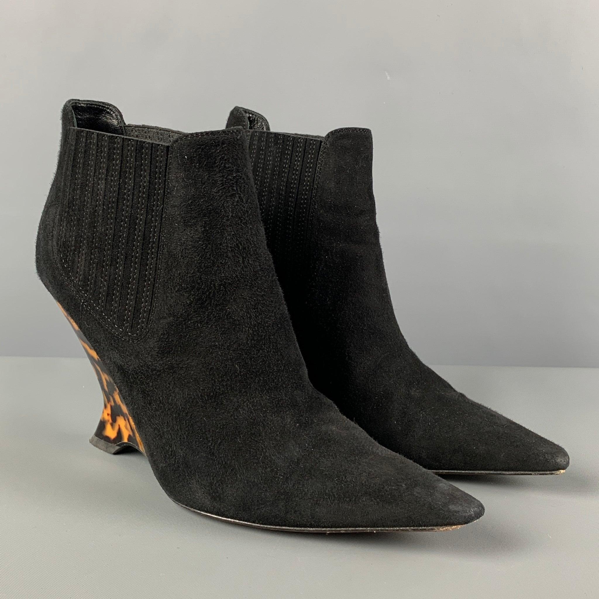 CHRISTIAN DIOR boots comes in a black suede featuring a pointed toe, stretch panel, and a tortoise shell acrylic heel.Very Good
Pre-Owned Condition. 

Marked:   37.5 

Measurements: 
  Heel: 3.75 inches 
  
  
 
Reference: 122737
Category: