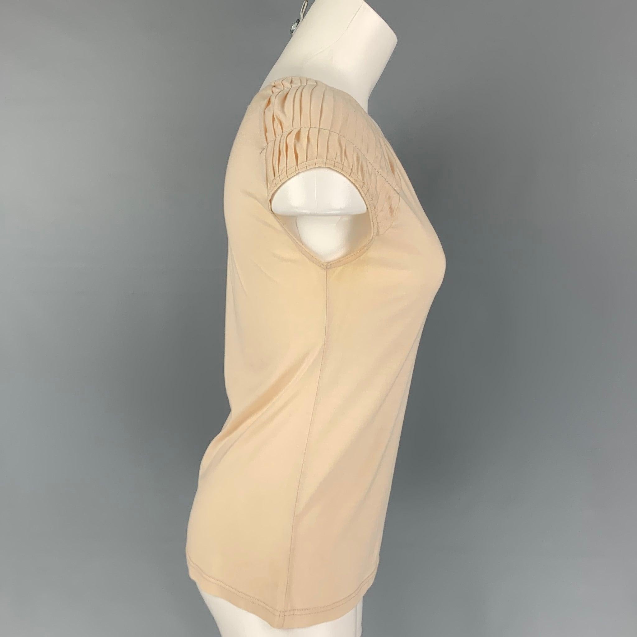 CHRISTIAN DIOR top comes in a beige silk / cotton featuring pleated cap sleeves, silver metallic trim, and a wide neckline. Made in Italy.
Good
Pre-Owned Condition. Moderate discoloration at under arms. As-Is.  

Marked:   F 40 / GB 12 / I 44 / D 38