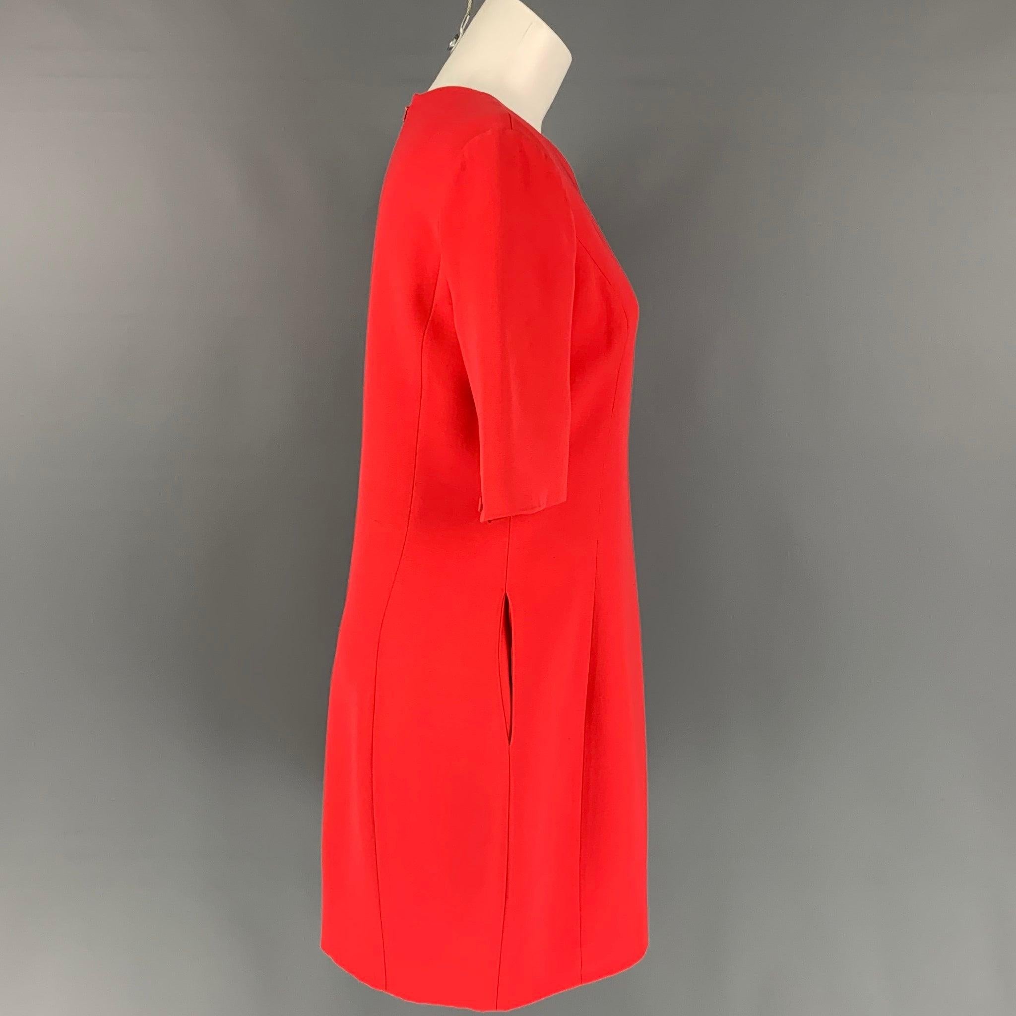 CHRISTIAN DIOR dress comes in a red wool / silk with a slip liner featuring 3/4 buttoned sleeves, slit pockets, and a back zipper closure. Made in Italy.
Very Good
Pre-Owned Condition. 

Marked:   F 40 / GB 12 / I 44 / D 38 / USA 8 

Measurements: 
