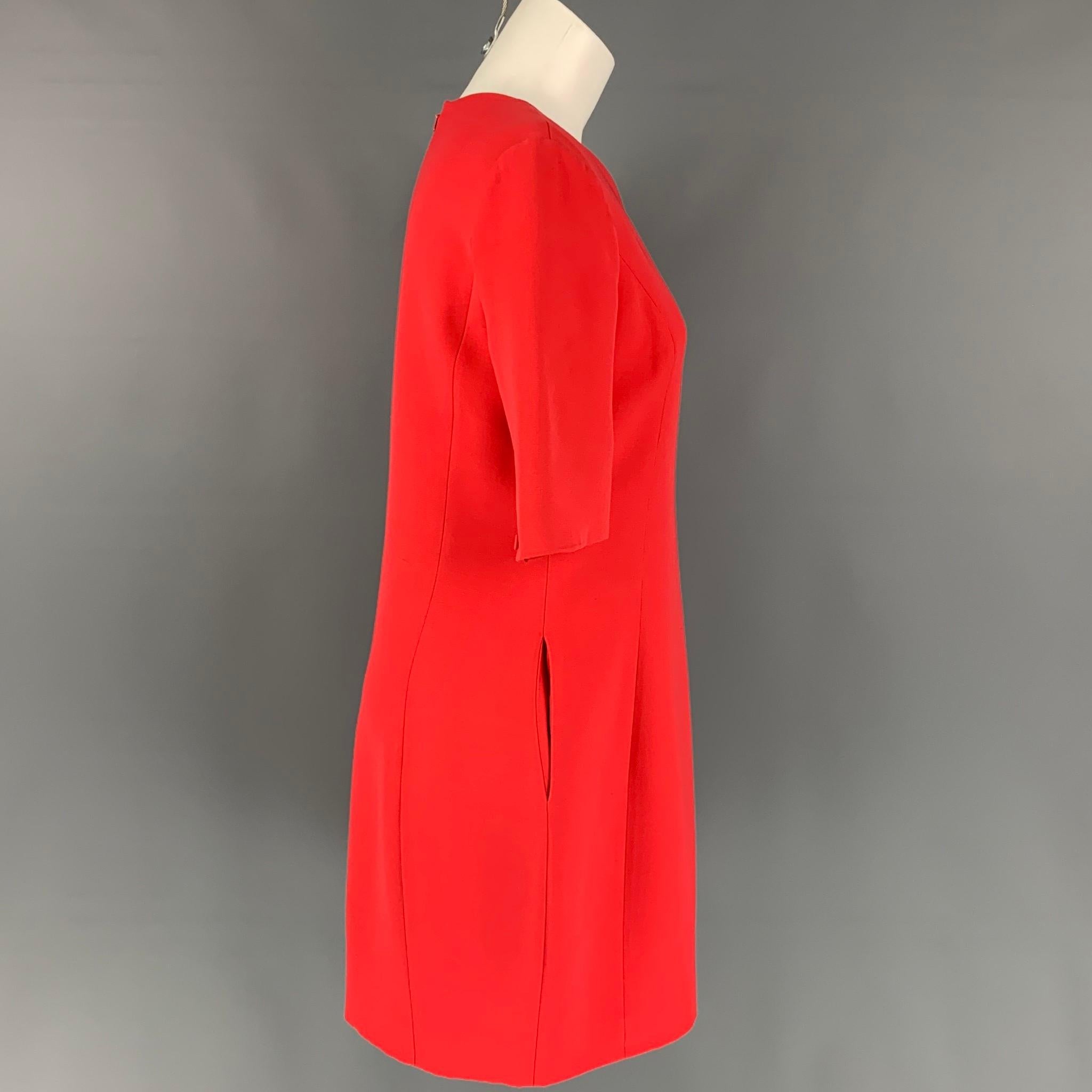 CHRISTIAN DIOR dress comes in a red wool / silk with a slip liner featuring 3/4 buttoned sleeves, slit pockets, and a back zipper closure. Made in Italy. 

Very Good Pre-Owned Condition.
Marked: F 40 / GB 12 / I 44 / D 38 / USA