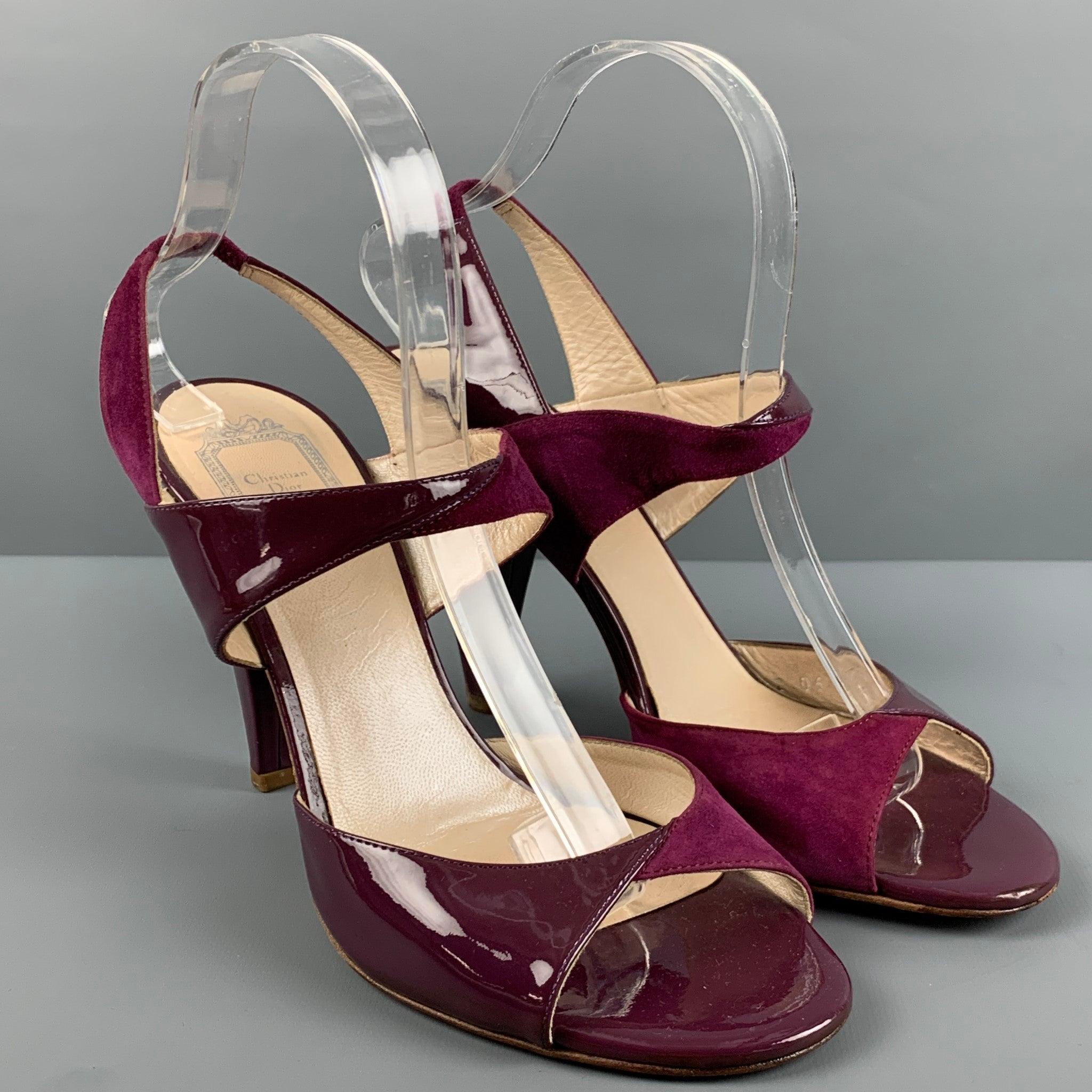 CHRISTIAN DIOR
sandals come in purple leather featuring a contrast material suede and patent leather, chunky heel, and elastic strap ankle. Made in Italy.Very Good Pre-Owned Condition. Moderate signs of wear. 

Marked:   12 06 BLHeel: 4.25 inches 
 