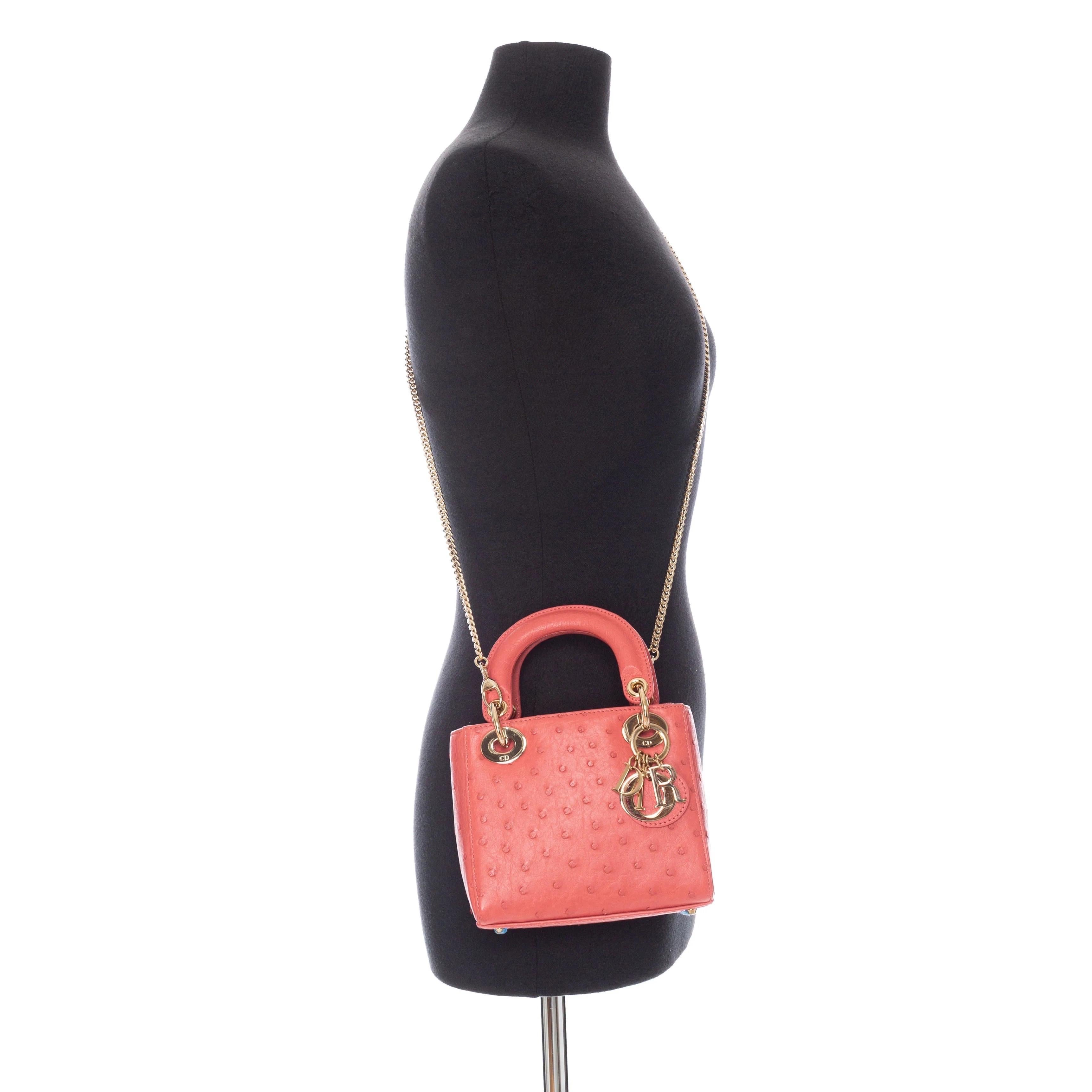 Christian Dior Small Ostrich Lady Dior Bag

2022 Collection
Pink
Ostrich embossed
Gold-tone hardware
Top rolled handle
Chain strap with shoulder strap
Flap closure at top 
Suede lining
Single interior pocket
Includes original authentication and dust