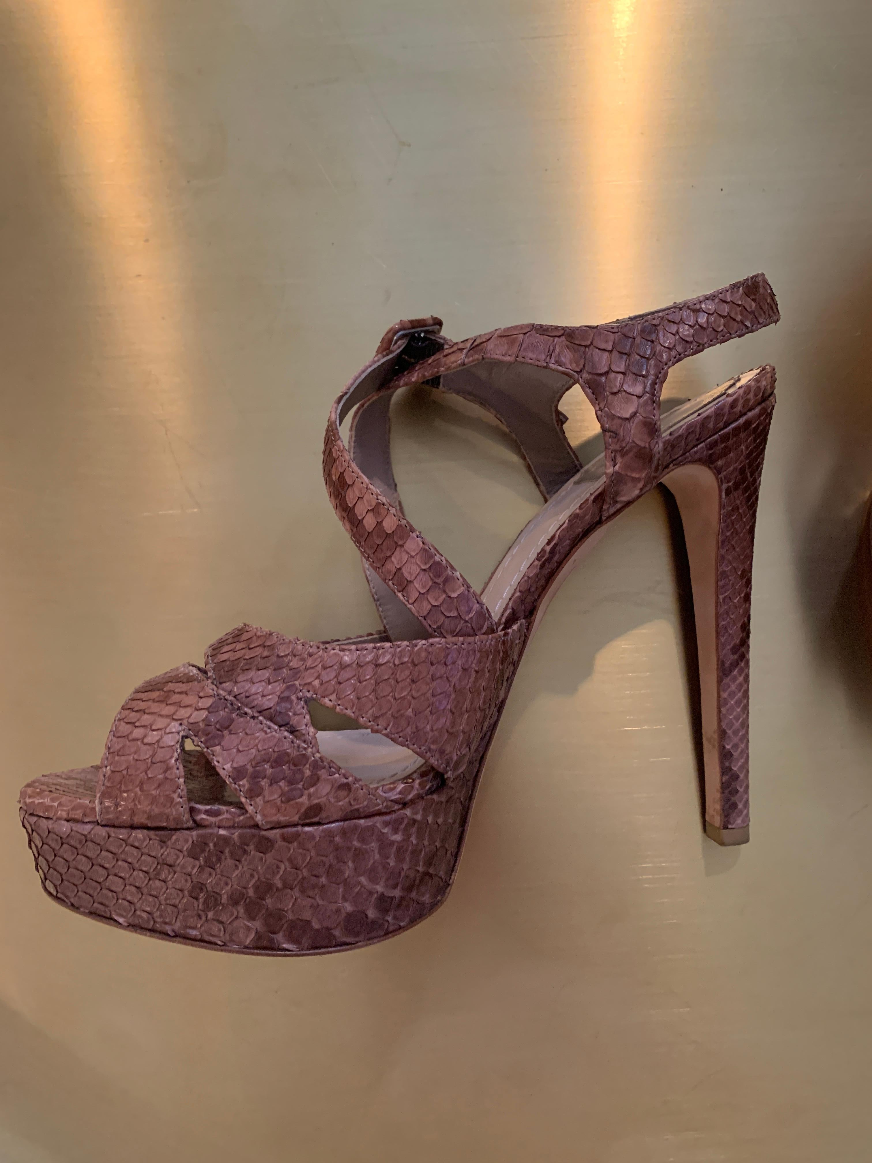 Vintage Christian Dior Snake Skin Platforms 
Mint Condition - never worn 
Multicolor Brown with cross strap and adjustable ankle 
Slight platform for more comfort 
These are show-stoppers! 
Size 40 