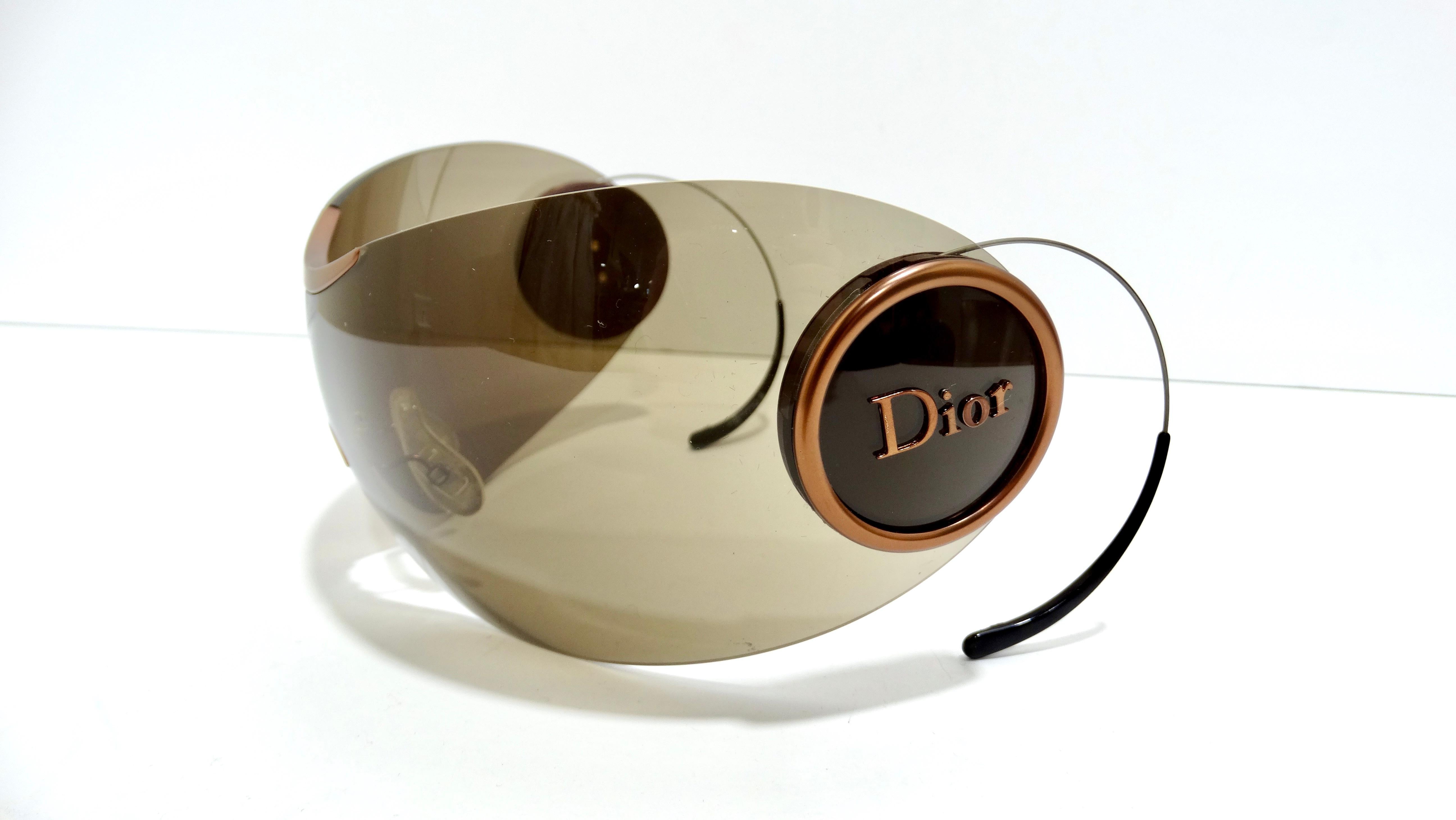 I could bet you that you haven't seen a pair of sunglasses quite like these! These iconic and rare Christian Dior sunglasses are super stylized and simple details that create such a cool look. They have a rimless single piece curved solid brown