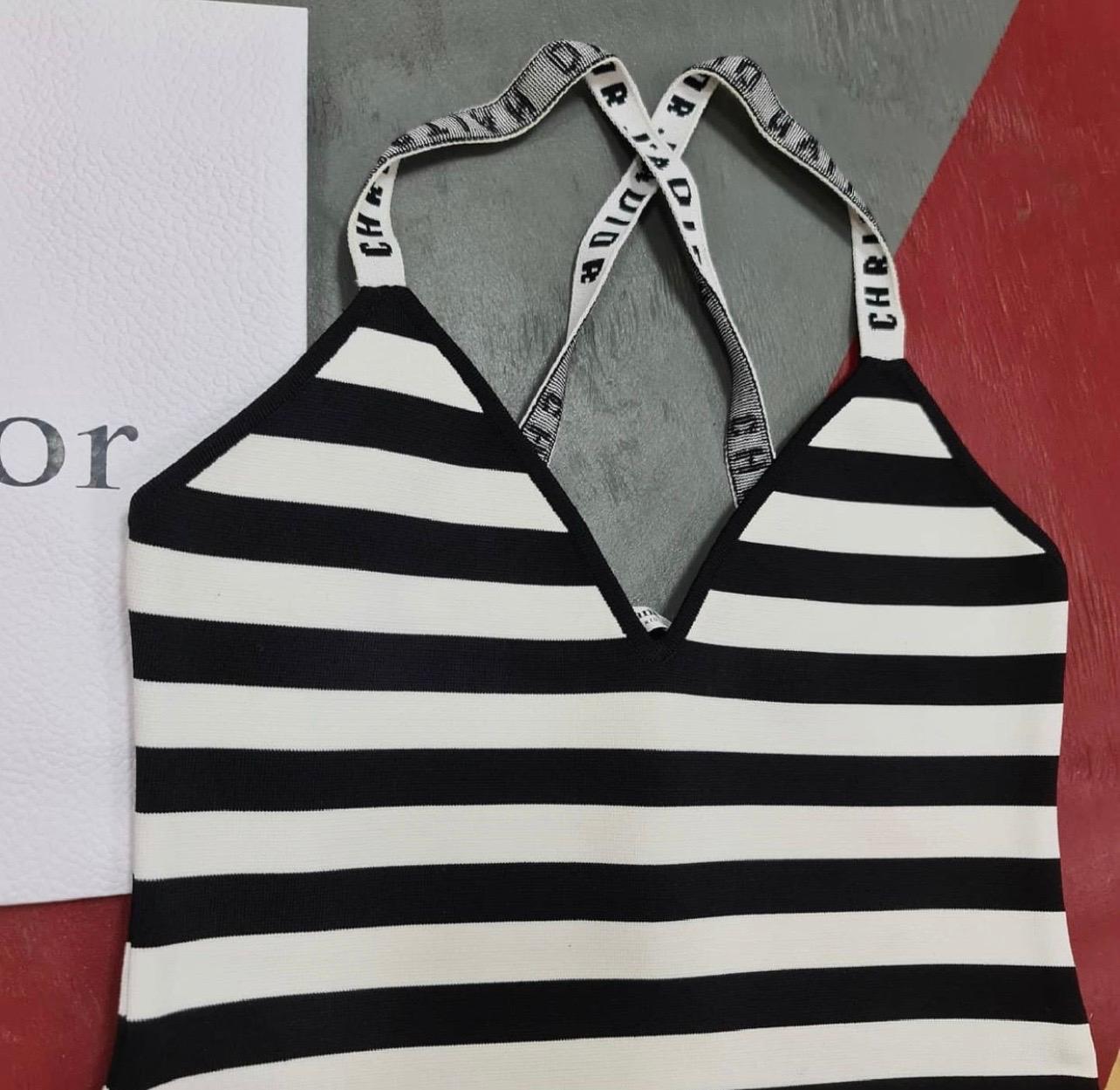 Look 32 from the Spring 2018 Collection. 
Black and white Christian Dior bodysuit featuring narrow shoulder straps and snap closures at inseam.

Sz.M

Condition is very good.

For buyers from EU we can provide shipping from Poland. Please demand if