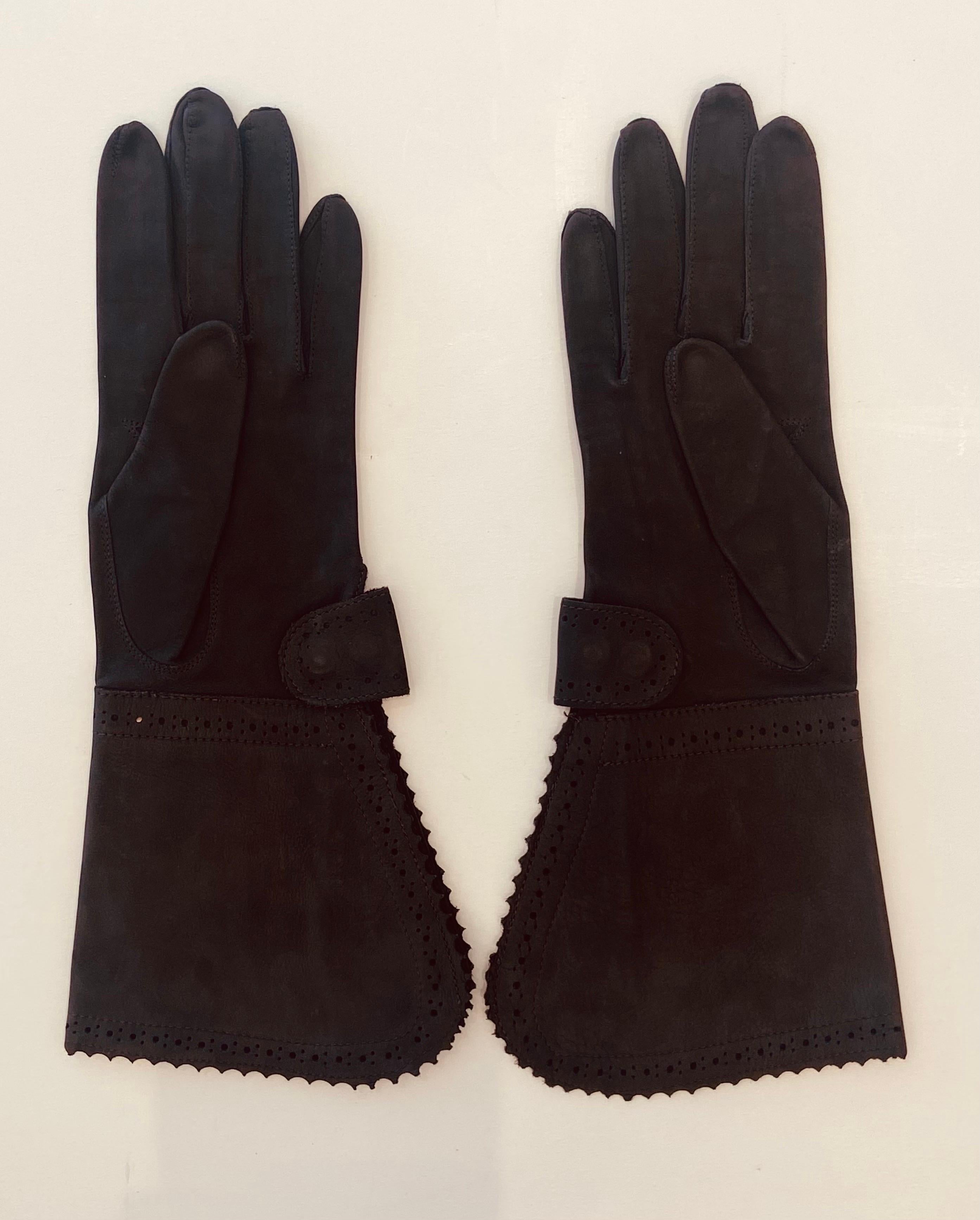 Christian Dior steel grey suede Veau Velours (soft finished calfskin) perforated gauntlet gloves with wrist tab snap that adds more or less room, from the 1980s, inside gusset. These gloves look barely worn. So soft, the decorative gauntlet will