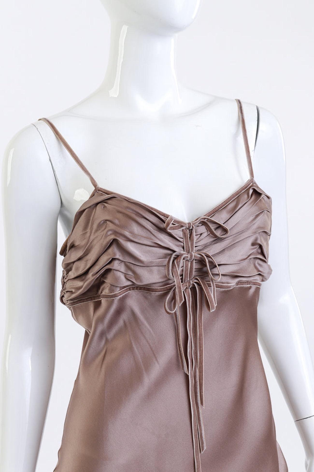 CHRISTIAN DIOR STRAPPY RUCHED BOW DRESS DUST PINK (US 4)

This Christian Dior maxi slip dress is from the early 2000s and features a silky pale mauve hue with velvet spaghetti straps, bustline trim, and triple decorative bows. It has a sweetheart