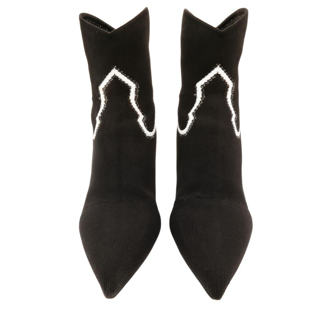 Black Christian Dior neoprene knit ankle sock boots with white Western style details. Comes with original box and dust bag. 

Features mid-height curved heel, pointed toes, and pull-on stretch knit material with rounded ankle detail.

Condition