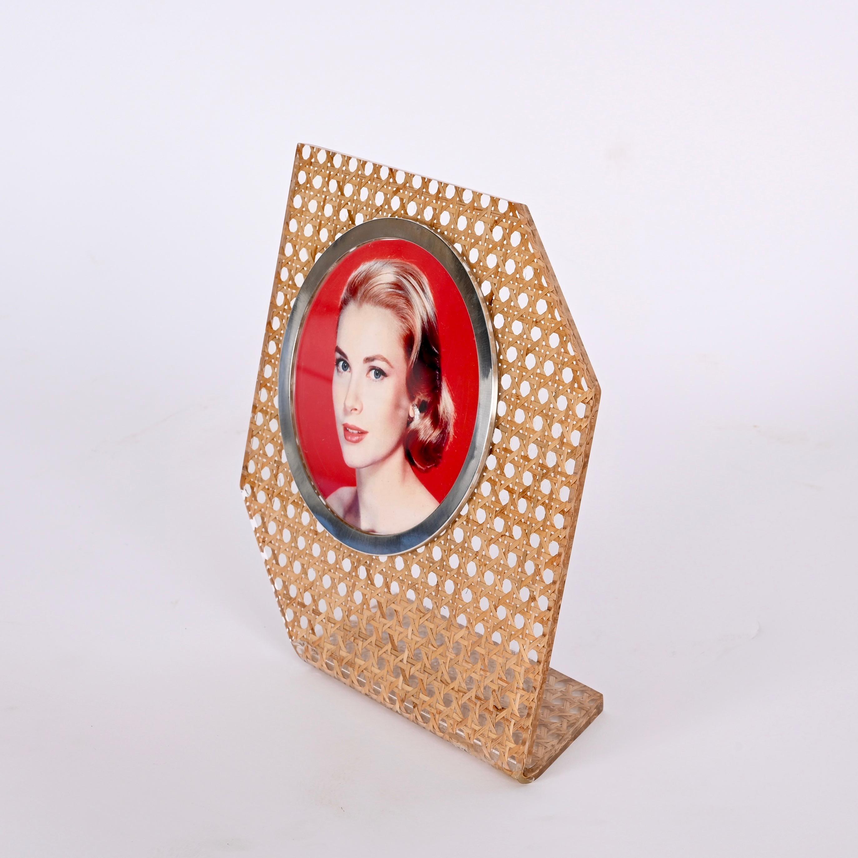 Stunning midcetury lucite and Vienna straw picture frame enriched with a silver frame. This astonishing item was made in Italy during the 1970s following the style of Christian Dior. 

This piece is unique as it has a Vienna straw structure with a