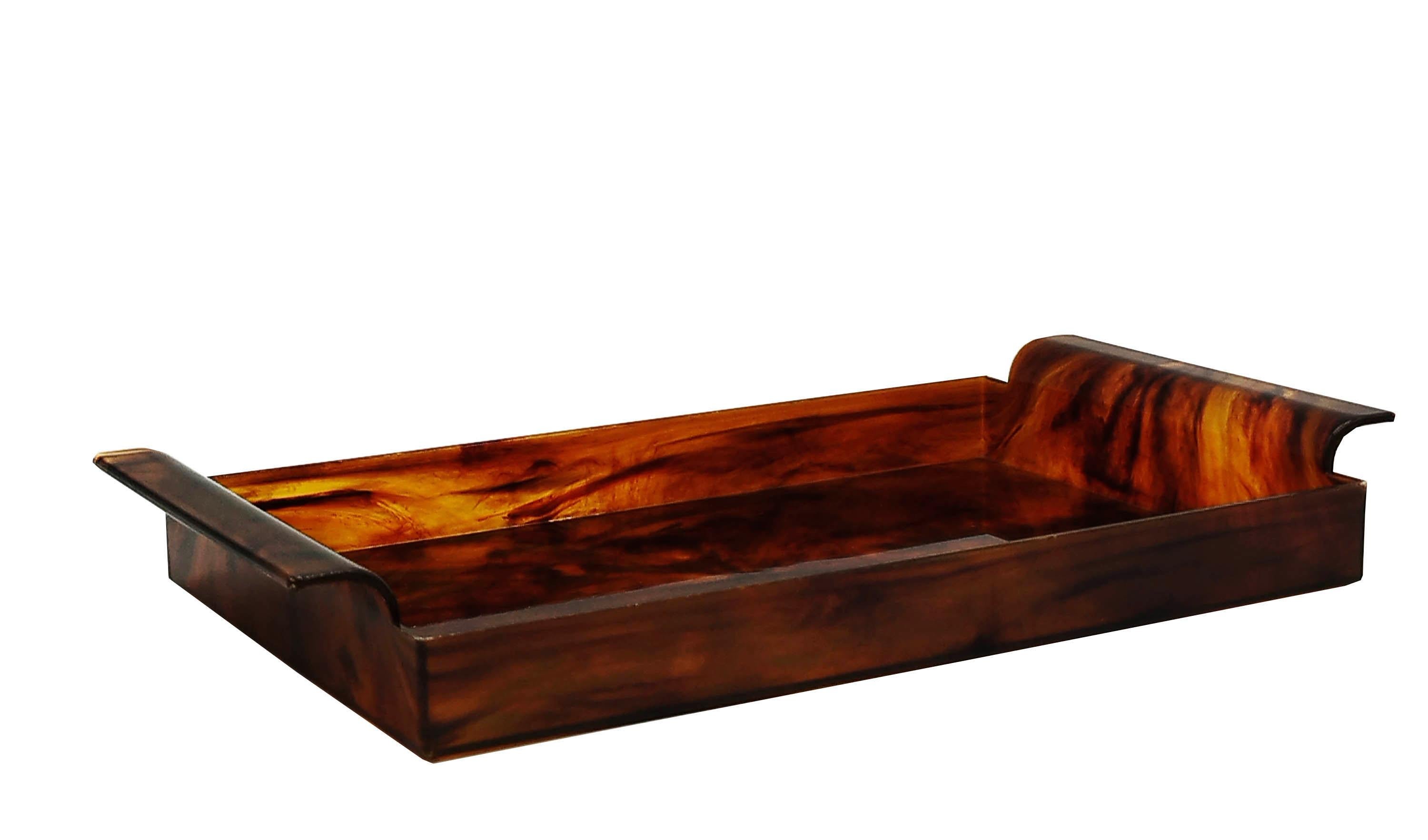 An incredible tortoiseshell lucite serving tray, this piece was produced in Italy in the 1970s and its design is attributed to Willy Rizzo, Gabriella Crespi, Tommaso Barbi, Christian Dior, Pierre Cardin.