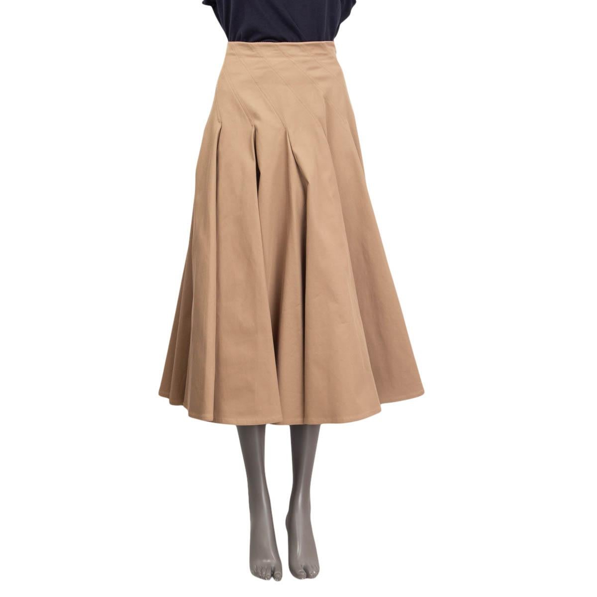 100% authentic Christian Dior diagonal pleated midi skirt in camel cotton (97%) and elastane (3%). Opens with diagonal concealed zipper and a hook on the back. Lined in camel silk (100%). Has been worn and is in excellent