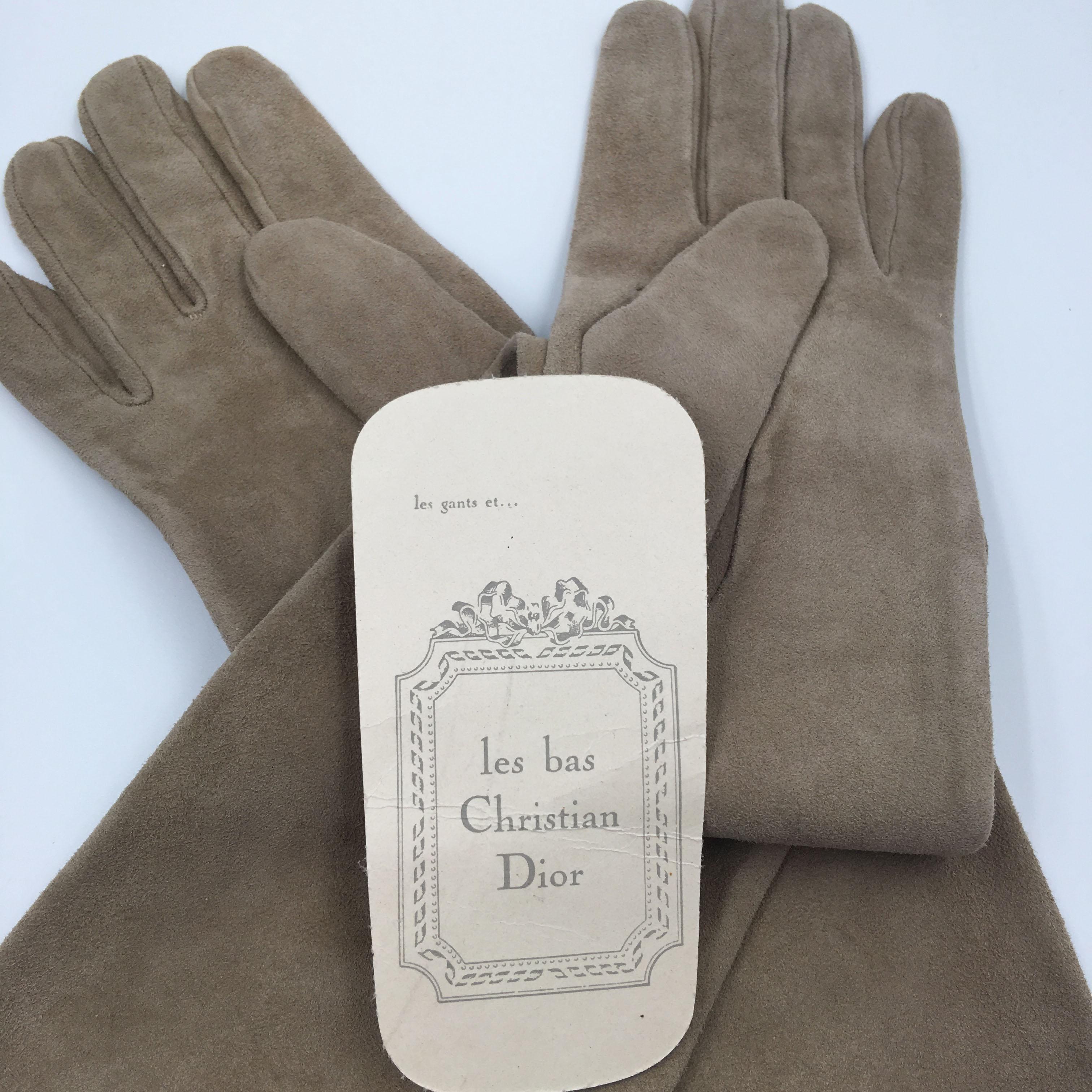 Christian Dior Tan Suede and Lace Trimmed Elbow Length Gloves. Original Christian Dior hang tag attached. Glove size 8. Woven Christian Dior tag inside. Made in France and Cuir Agneau 100% Soir tag. Very good condition. As you can see, from the