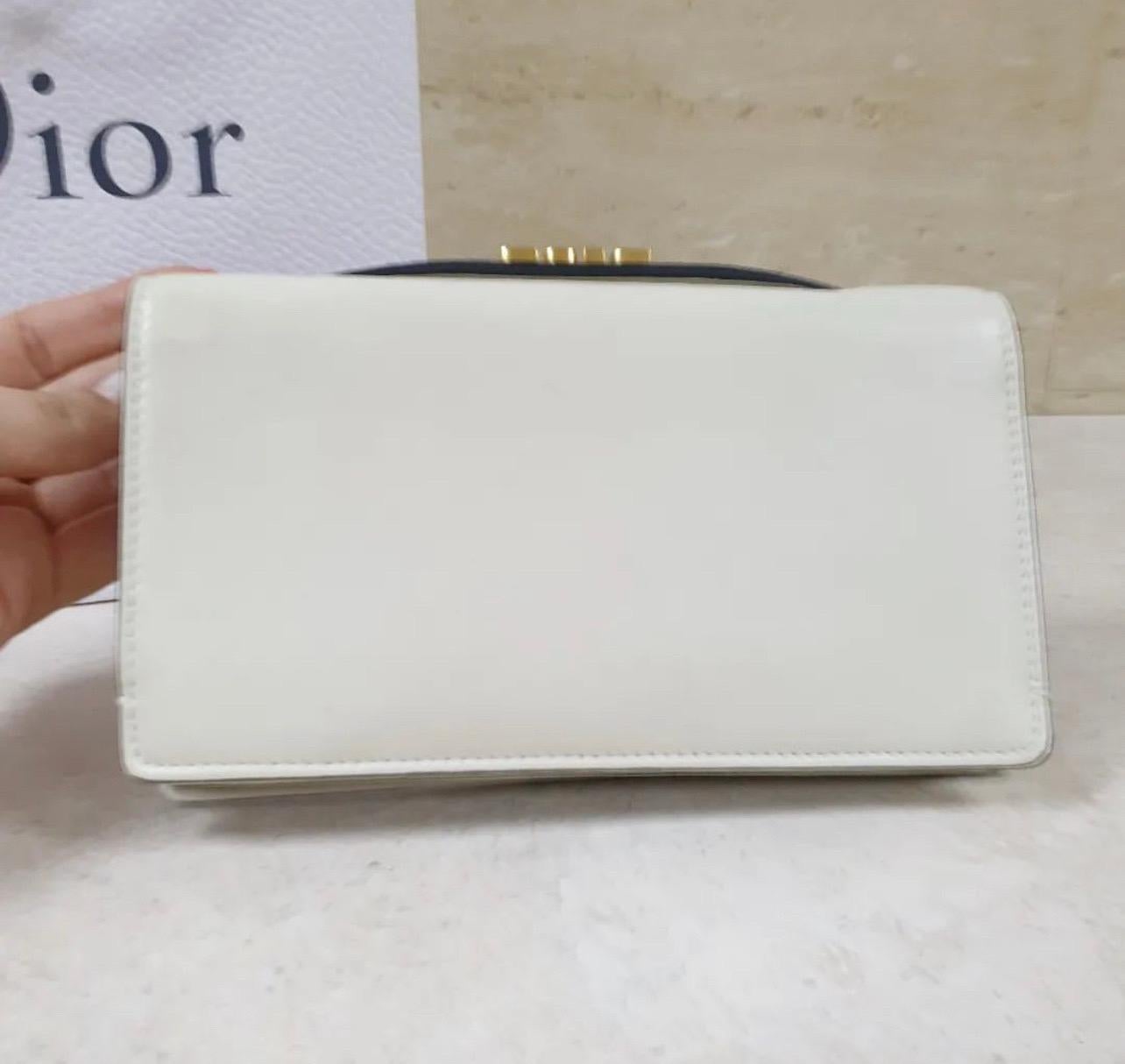 From the 2017 Collection. Ivory leather Christian Dior Tarot La Roue De La Fortune Clutch with gold-tone hardware, single flat top handle tonal interior, three interior compartments, single card slot and flap closure at front flap.

18.5*10.5
Good