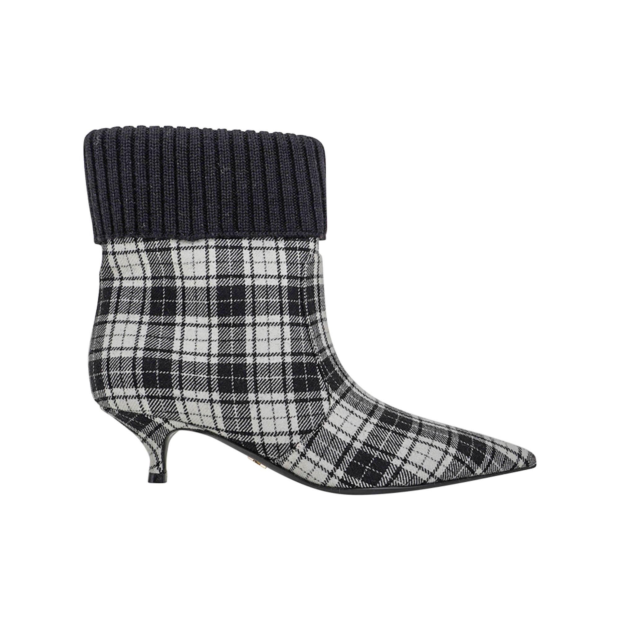 Christian Dior Tartan Fabric Beat Ankle Boot featured in Black and White.
Fold down black knit ribbed fabric at top of shoe.
Pointed toe and a 2