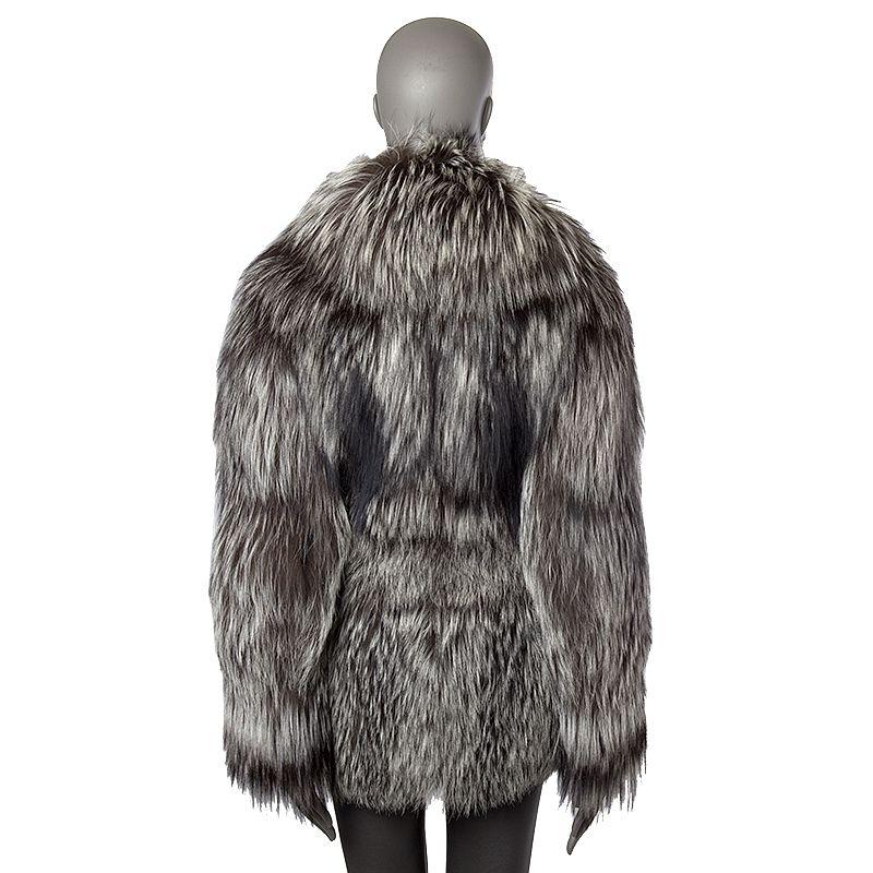 Christian Dior coat in off-white, brown, and taupe fox fur with wide collar. Two side pockets. Opens with two hooks on the front. Lined in black silk. Has been worn and is in excellent condition. Retails for $ 35'000.-

Tag Size 38
Size M
Shoulder