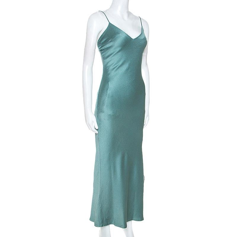 An exquisite fusion of class and grace, this Dior ensemble will lend an edge to your personality. Crafted from quality materials, this slip dress comes in a lovely shade of teal. It has been cut to offer a fitted silhouette, features thin straps,