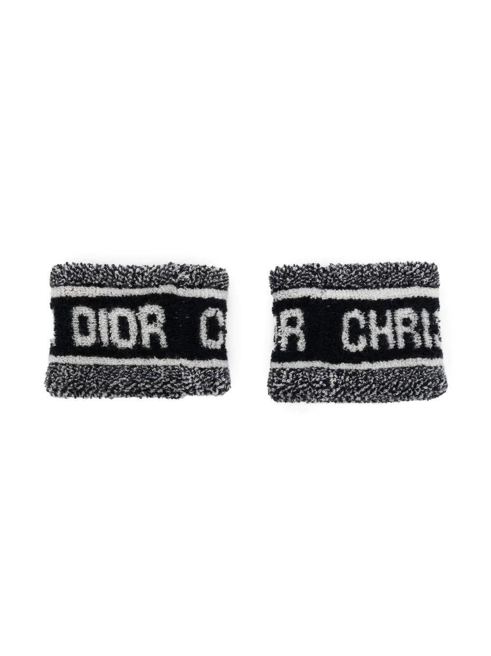 Perfect for a chic Tennis look, these terry Dior wristbands are both practical and a collector's item. This piece features terry cloth all over with the Christian Dior logo at the front of both bands

Colour: Blue & White

Size: