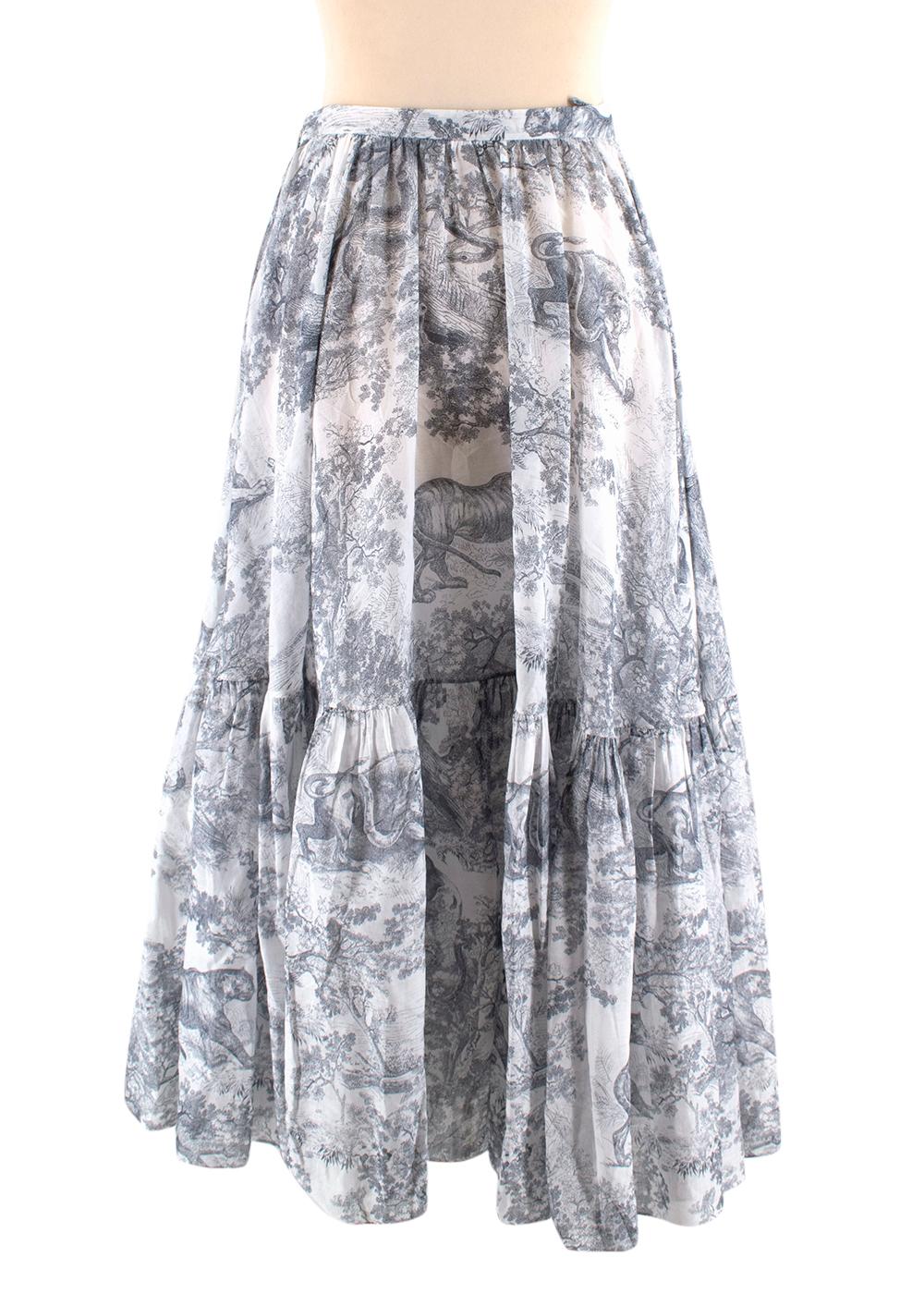 Christian Dior Toile De Jouy Printed Viola Skirt 

- House Emblematic Toile De Jouy Print 
- Hem Pleated 
- Comes With An Under Skirt
- Lightweight
- Side Concealed Zip Closure With Hook Fastening  
- Falls Mid-Length 

Material:
- 100% Cotton