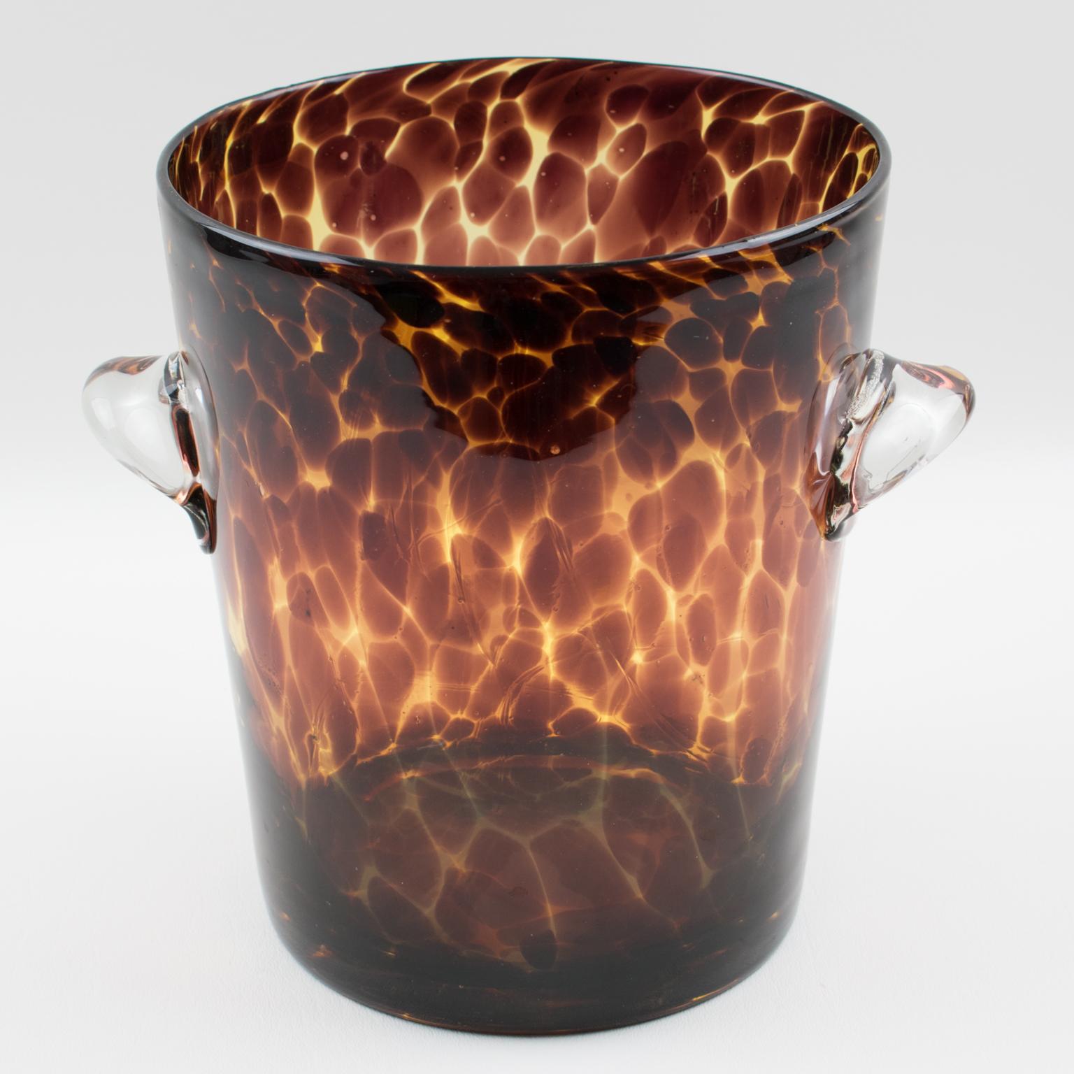1960s French designer Christian Dior glass ice bucket or champagne cooler or wine cooler, mouth-blown in Empoli, Italy. From the Dior Home collection, exclusive tortoiseshell color flowing pattern. Lovely clear glass handles on the