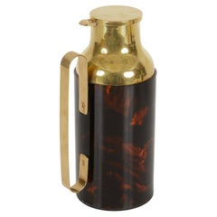 Christian Dior  Caraffa termos in lucite e ottone effetto tartaruga, Italia 1970